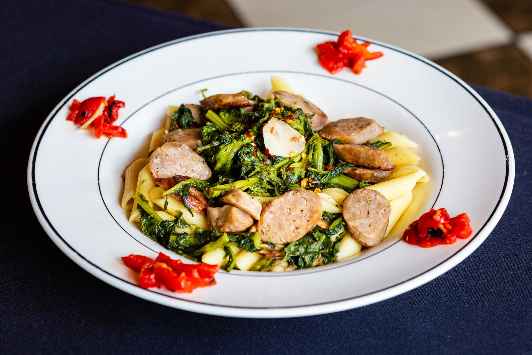Order Penne with Sausage & Broccoli Rabe - Small food online from Mona Lisa Pizzeria Ristorante store, Bayonne on bringmethat.com
