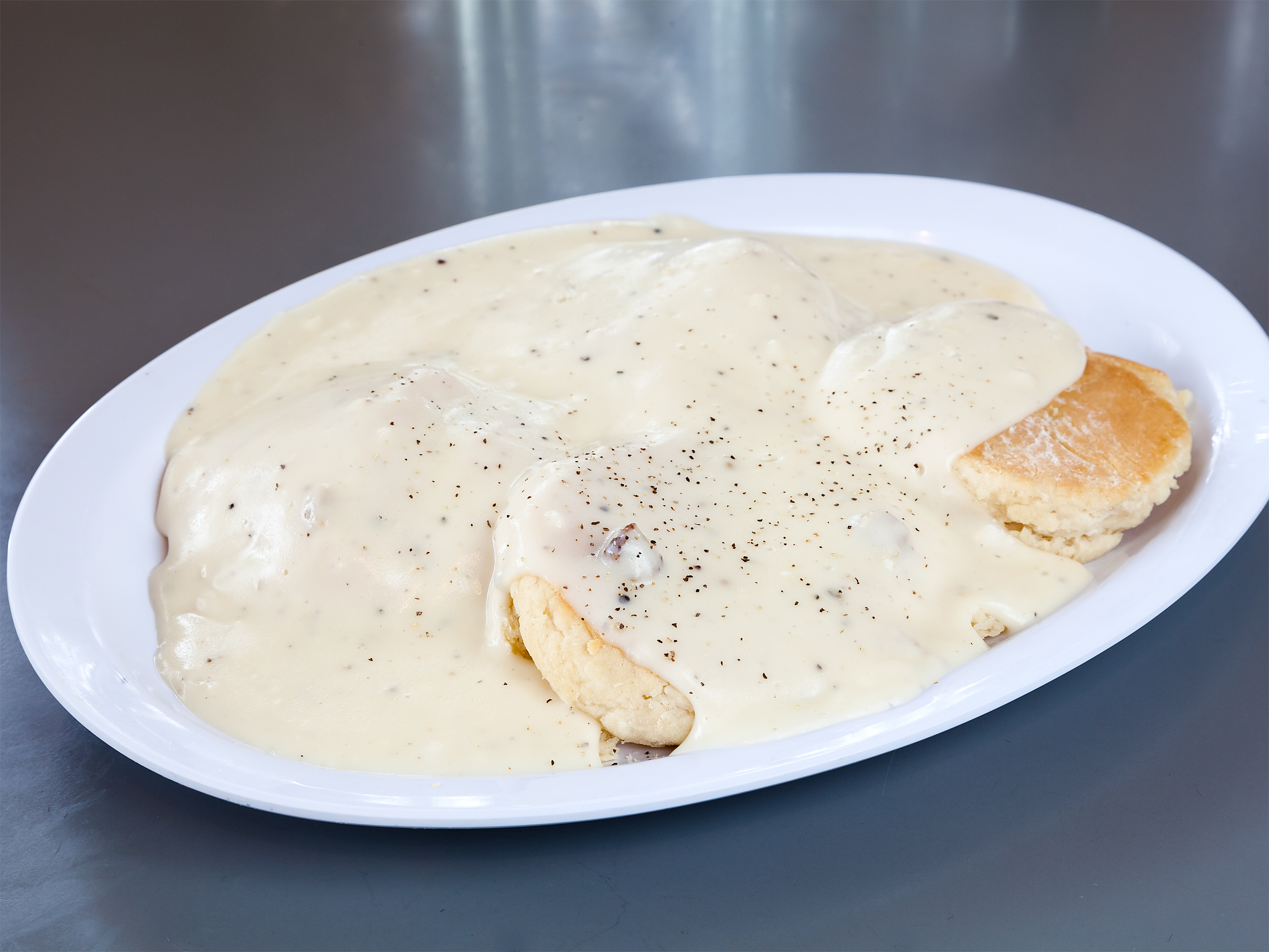 Order 1 Biscuit and Gravy food online from Donna Kaye Cafe store, Bakersfield on bringmethat.com