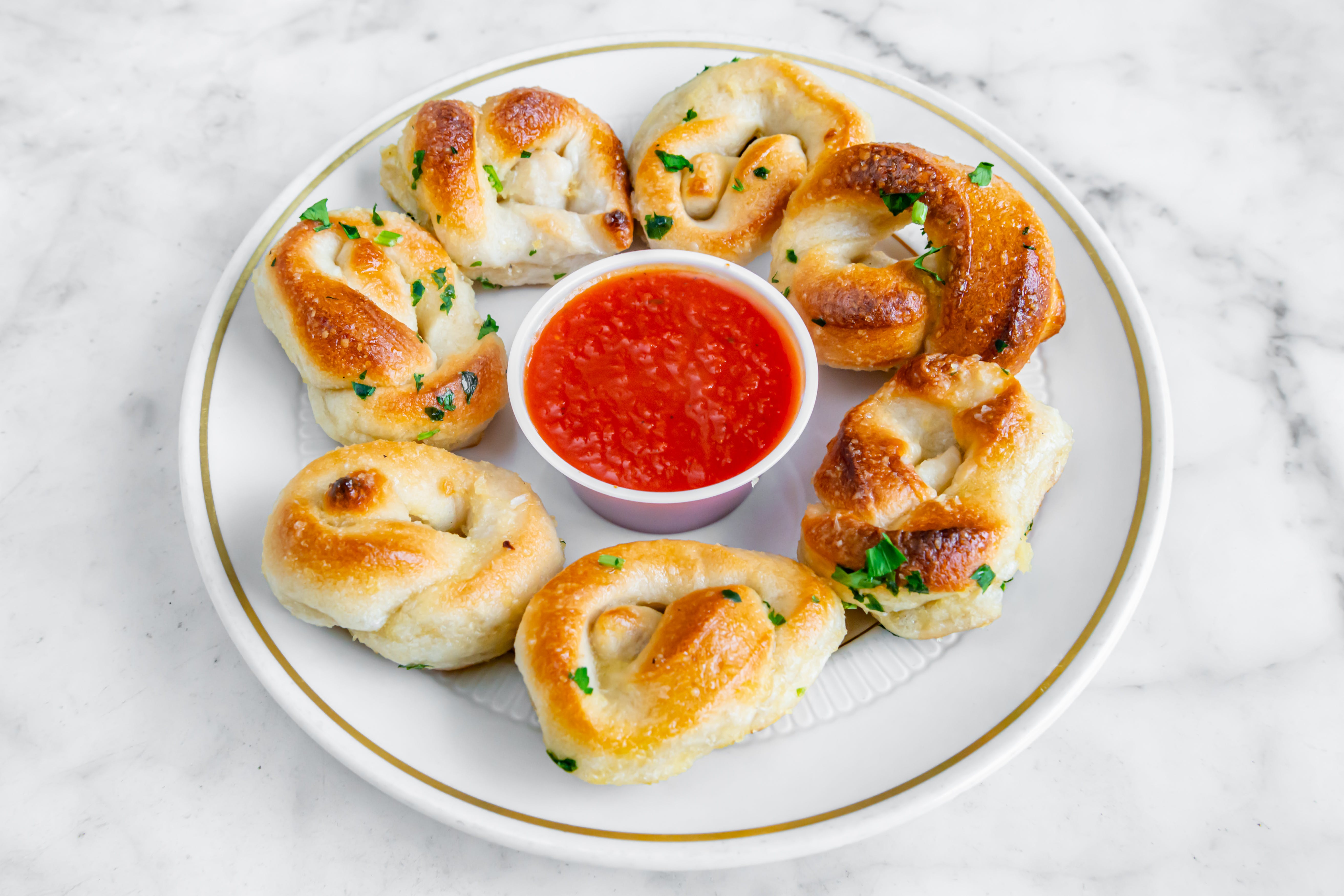 Order Garlic Knots - 6 Pieces food online from Corato pizza i store, Ridgewood on bringmethat.com