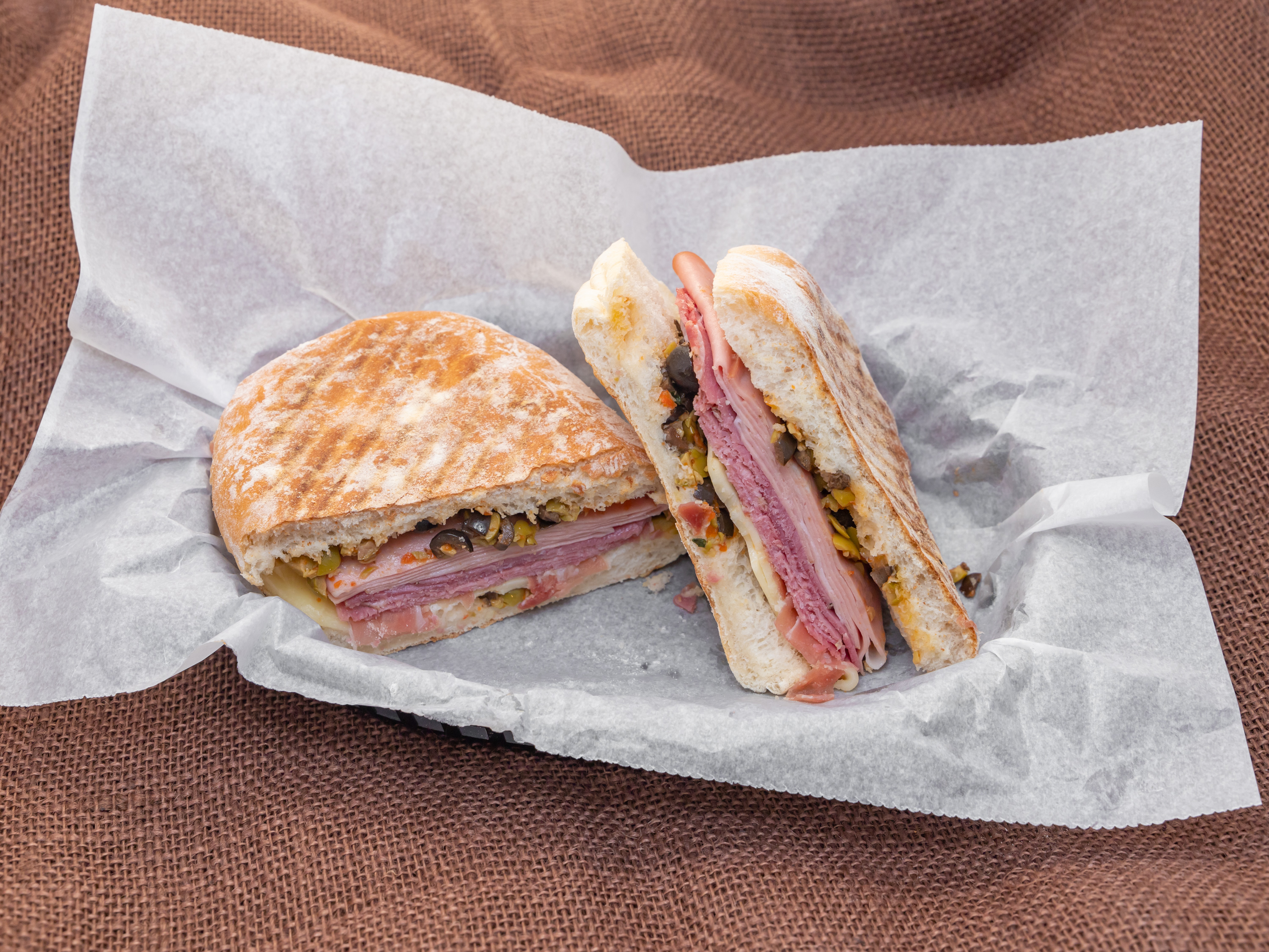 Order Muffuletta Sandwich food online from Cucina Mia Cafe And Deli store, Quincy on bringmethat.com