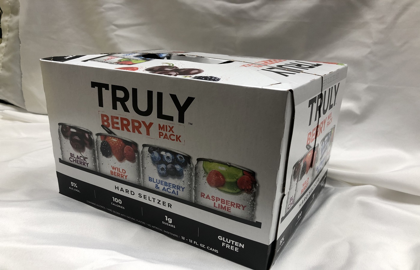 Order Truly Hard Seltzer Berry Mix Variety 12 Pack food online from Village Wine & Spirits store, Ventura on bringmethat.com