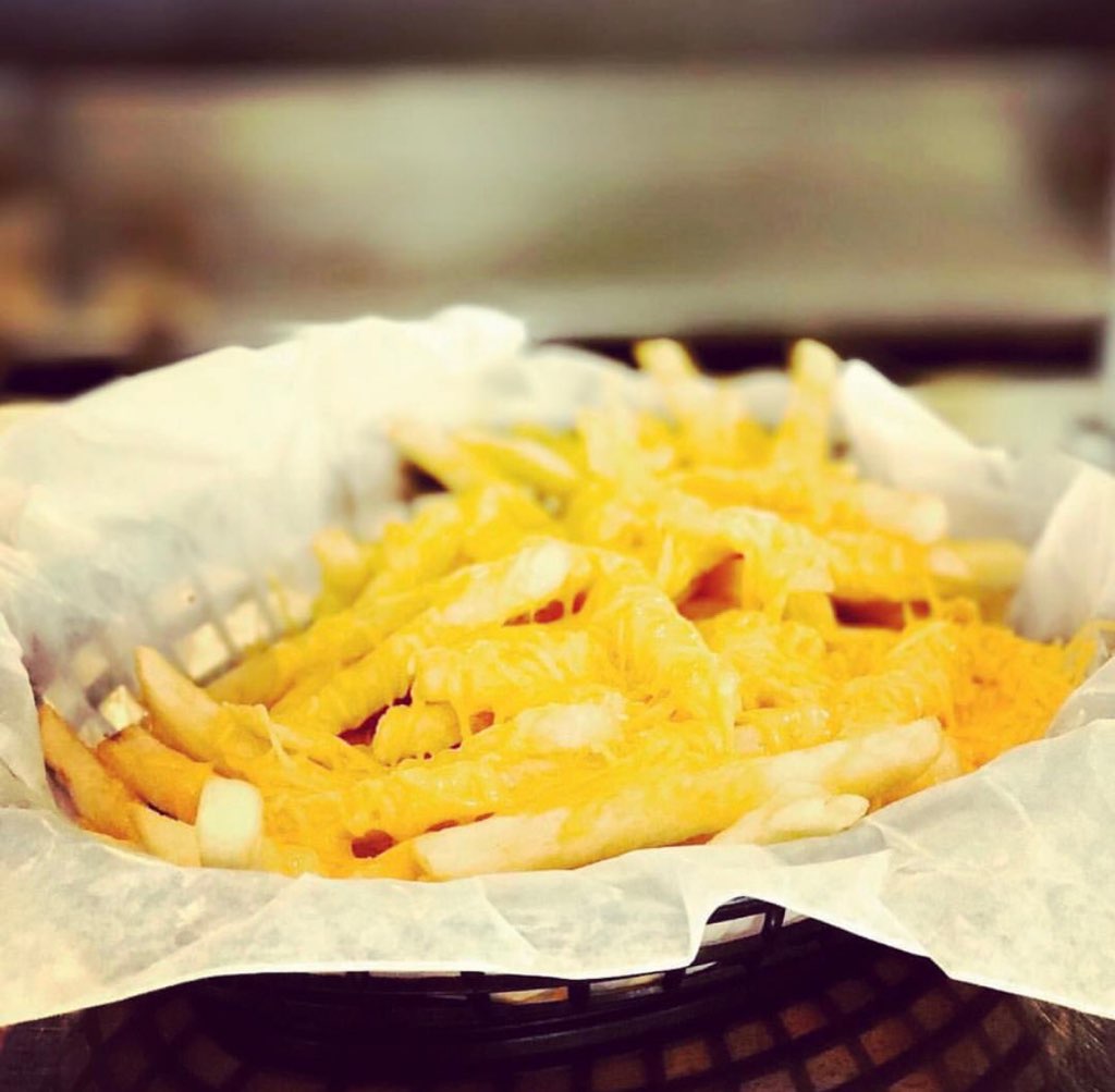 Order Pile of Fries with Melted Cheddar Cheese food online from Chase Diner store, Chandler on bringmethat.com