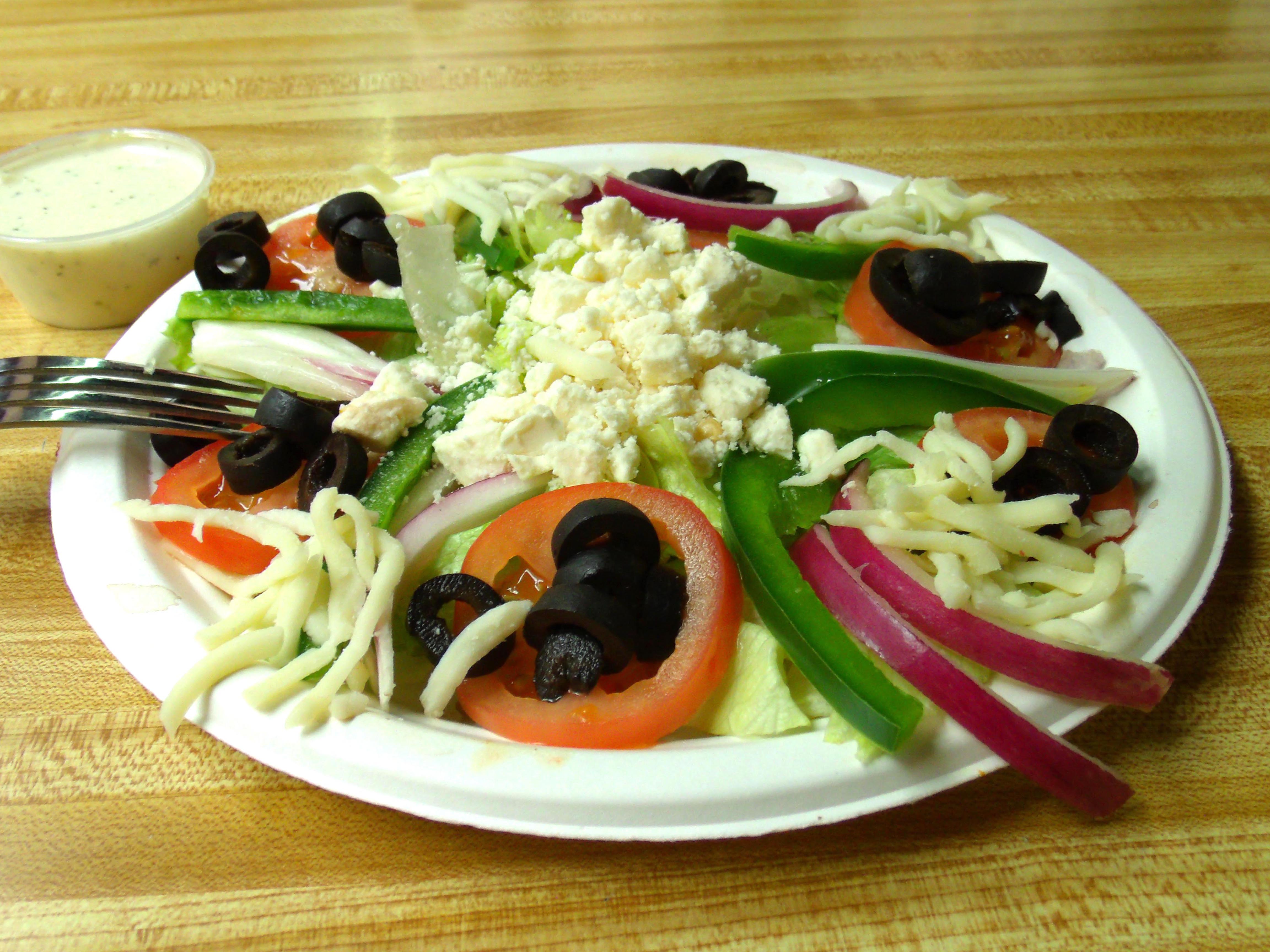 Order Greek Salad food online from Papa's Pizza store, New Orleans on bringmethat.com