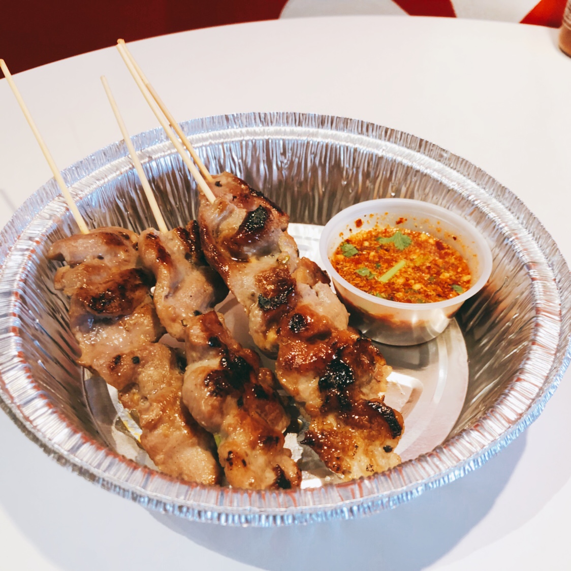 Order Grill pork skewer (moo ping) food online from Rice Thai To Go store, Southington on bringmethat.com