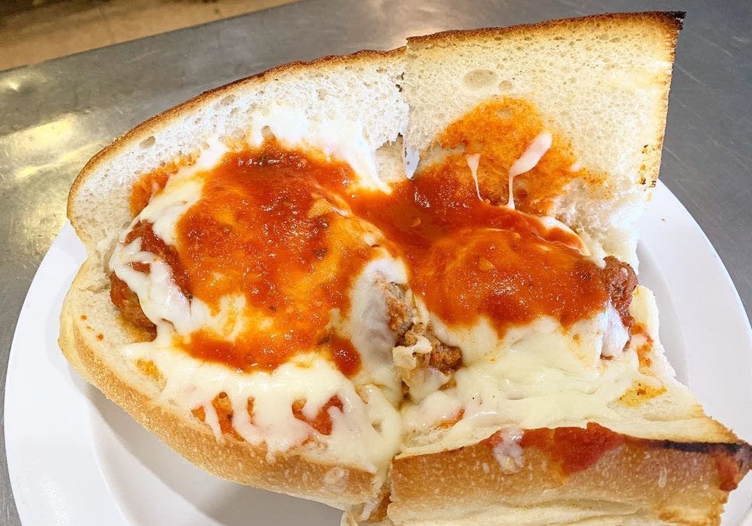 Order Meatball Parmigiano Sub - Half 8'' food online from Pasquales Pizzeria store, Wall Township on bringmethat.com
