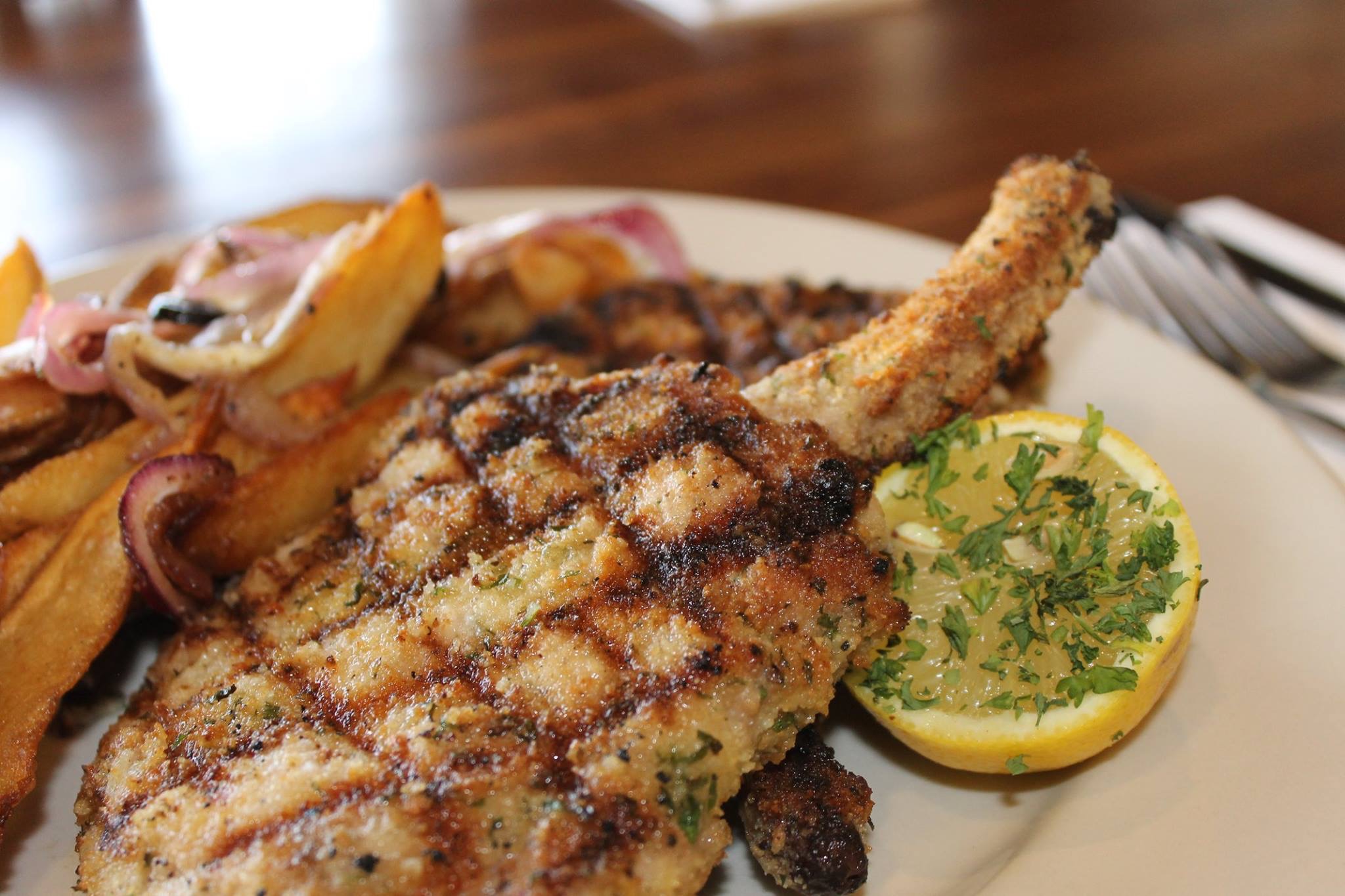 Order Pork Chop Milanese food online from The Pasta House Co store, Creve Coeur on bringmethat.com