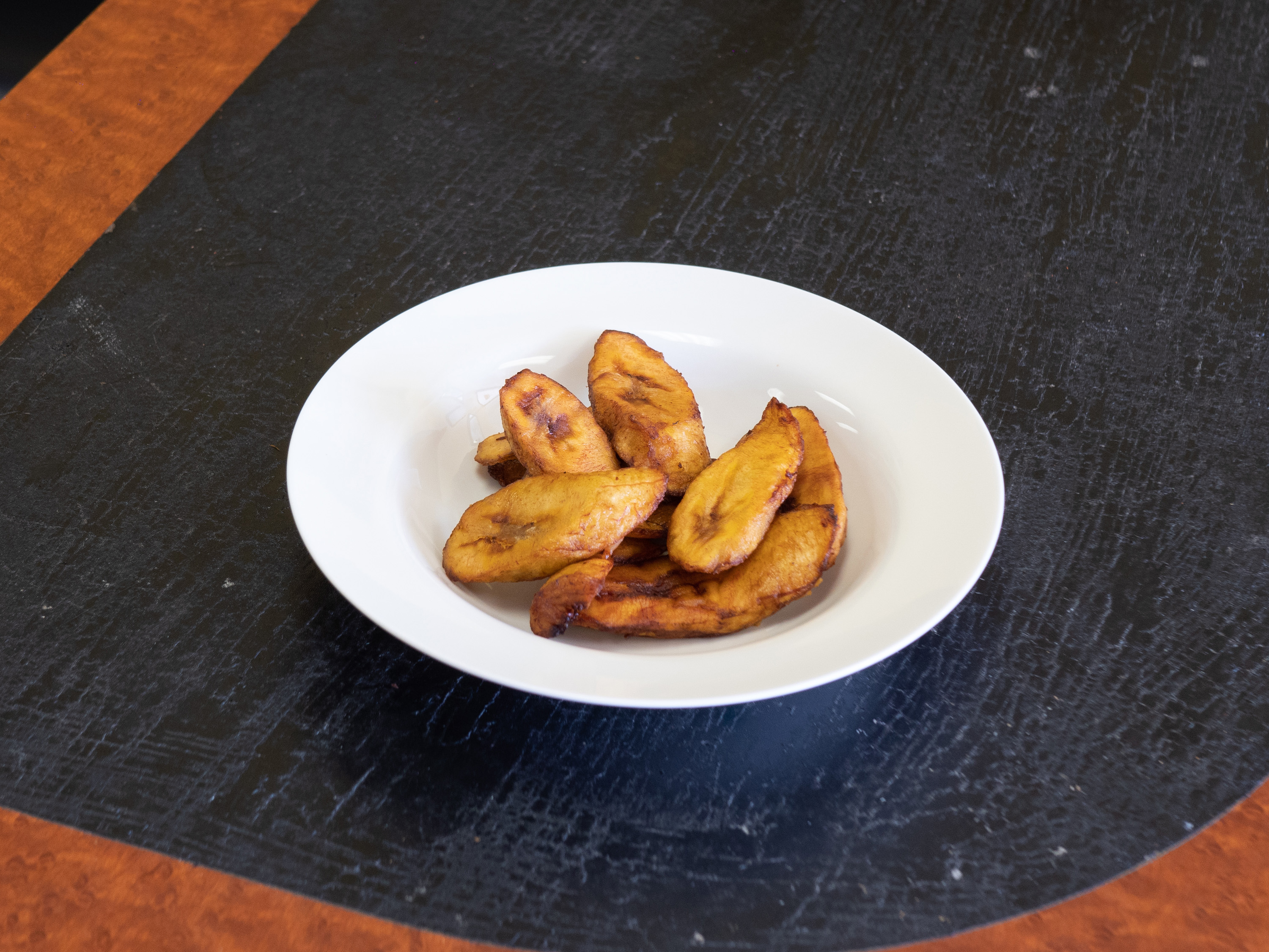 Order Fried Plantains food online from Kemi's Kitchen store, Grand Prairie on bringmethat.com