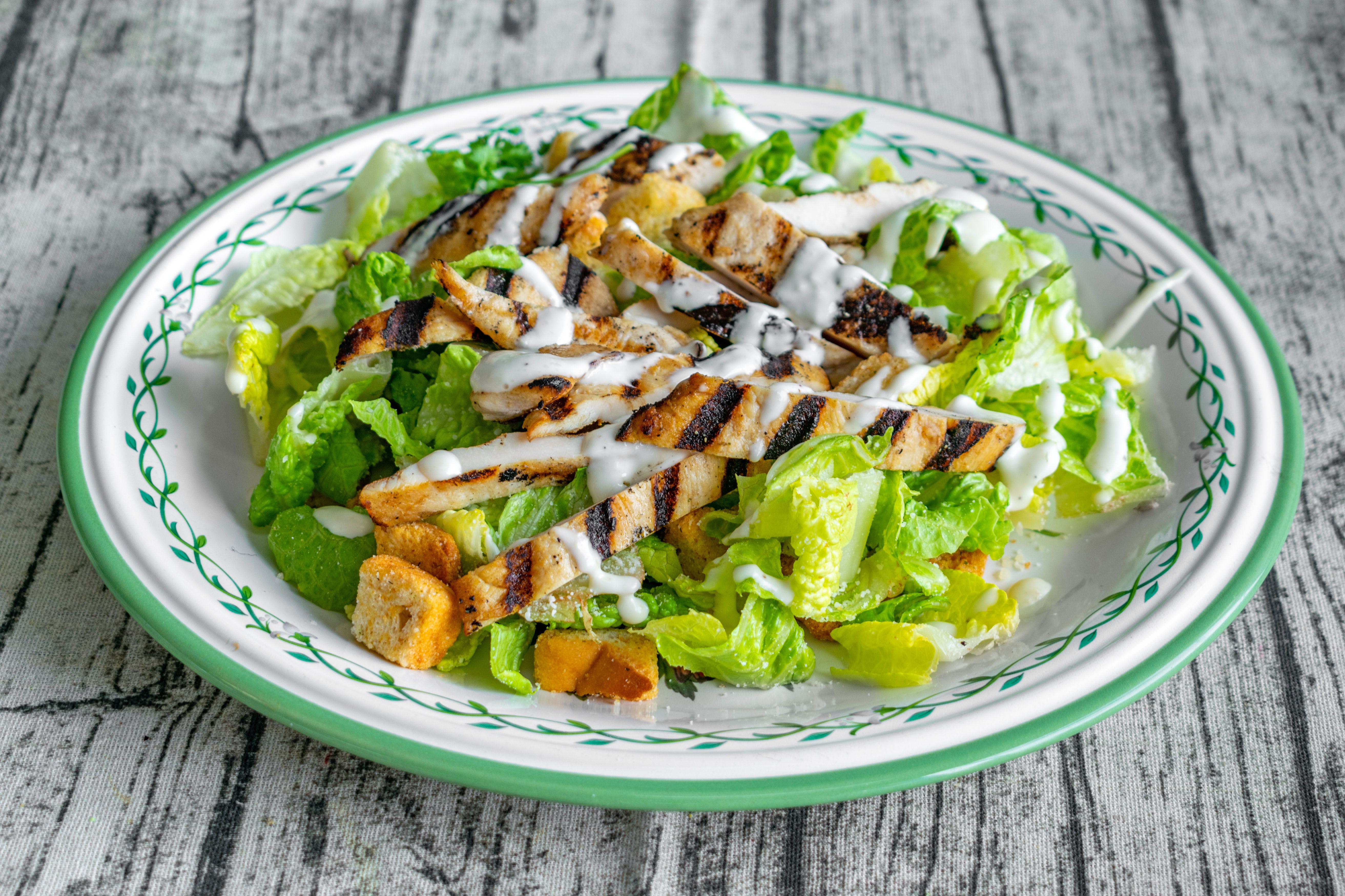 Order Caesar Salad - Salad food online from Biby's Empanadas & Pizza store, Fair Lawn on bringmethat.com