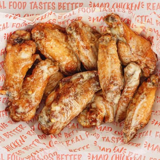 Order 12 TRADITIONAL WINGS * food online from Mad Chicken store, Ashwaubenon on bringmethat.com