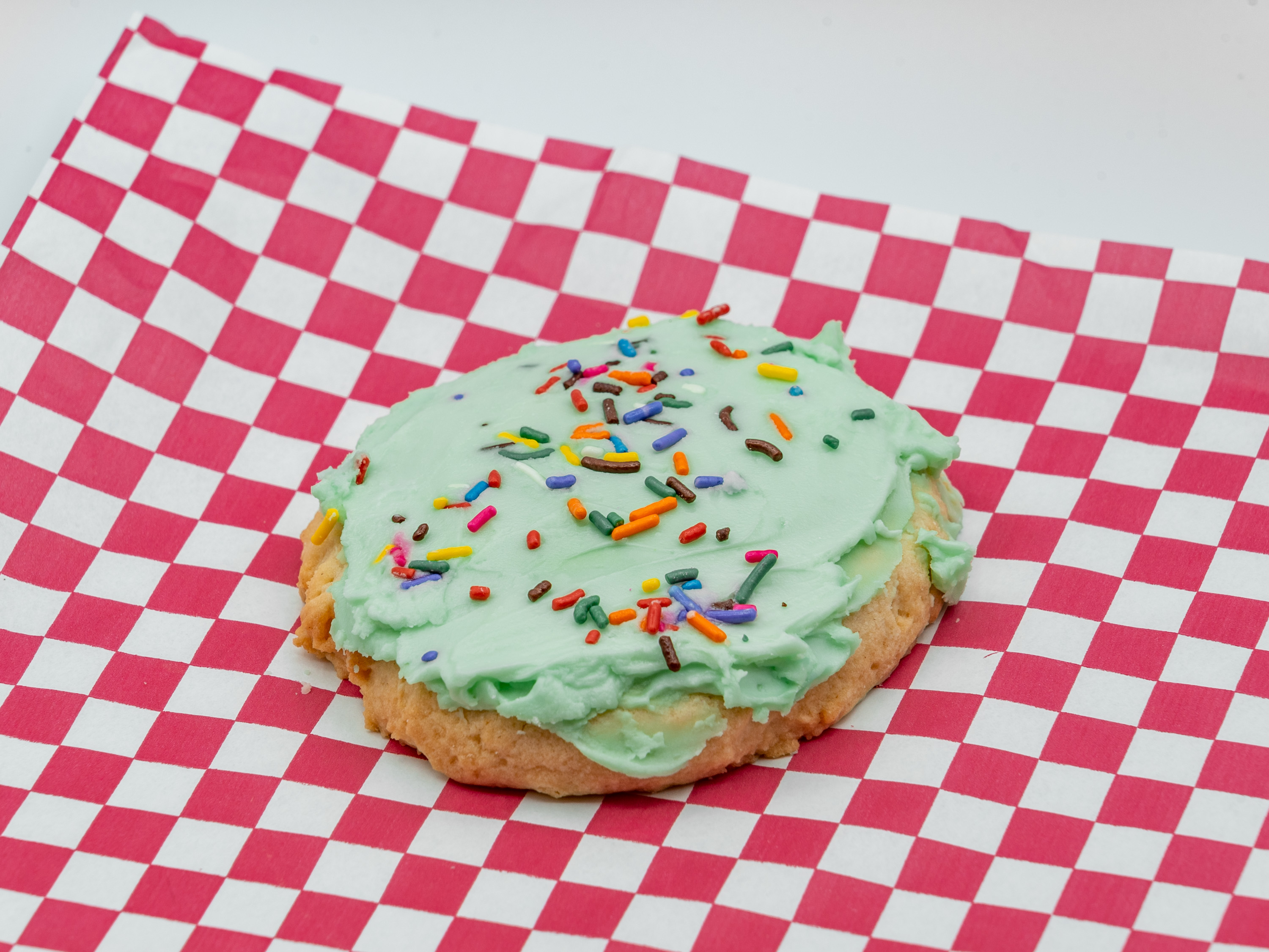 Order Huge Chilled Frosted Sugar Cookie With Sprinkles - 4 Pack food online from Dino's Cookies store, Charlotte on bringmethat.com