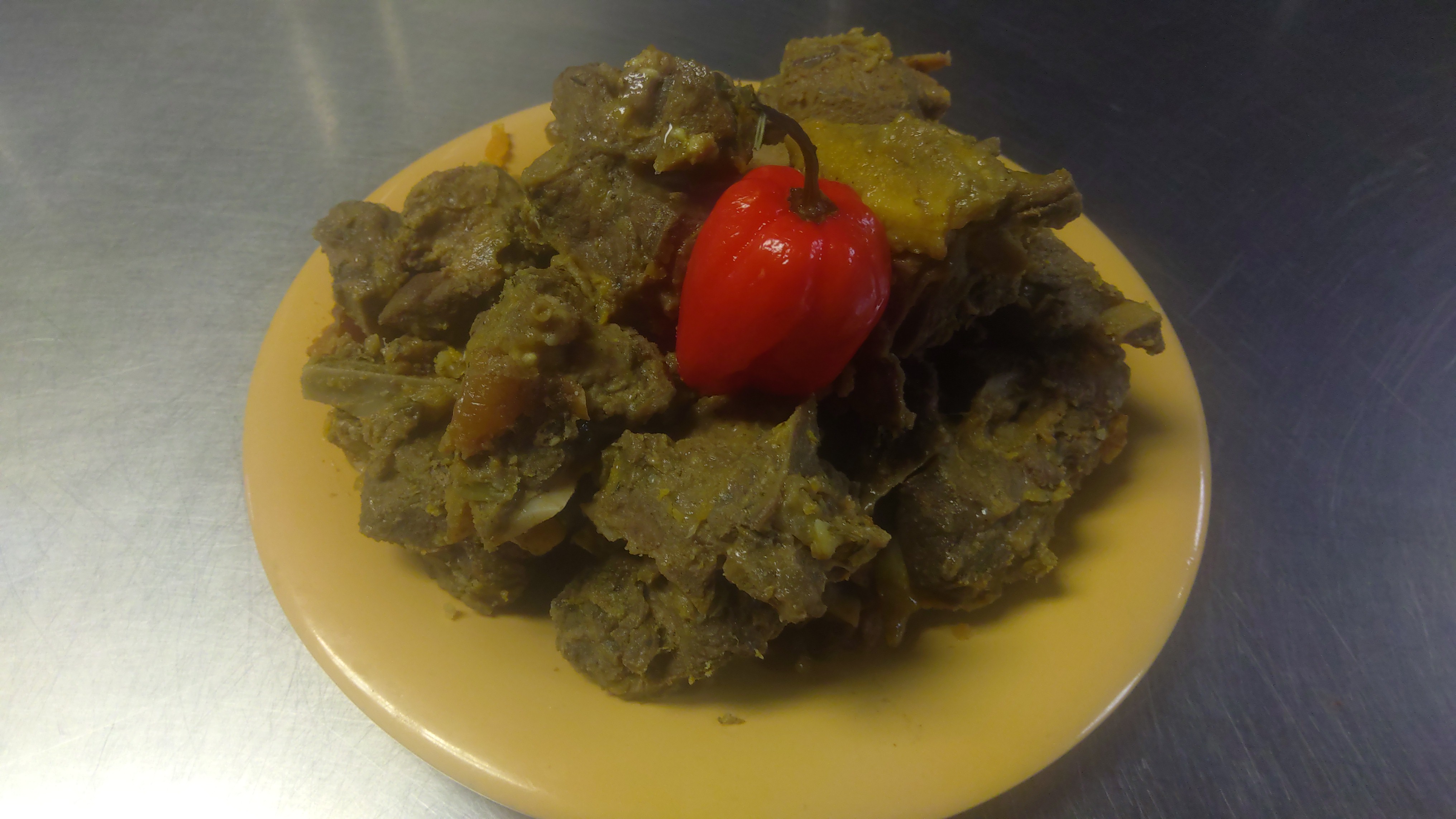 Order 9b. Curry Goat  food online from Africana Cuisine store, Perry Hall on bringmethat.com