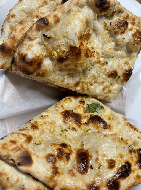 Order Garlic Naan food online from Urban curry store, San Francisco on bringmethat.com