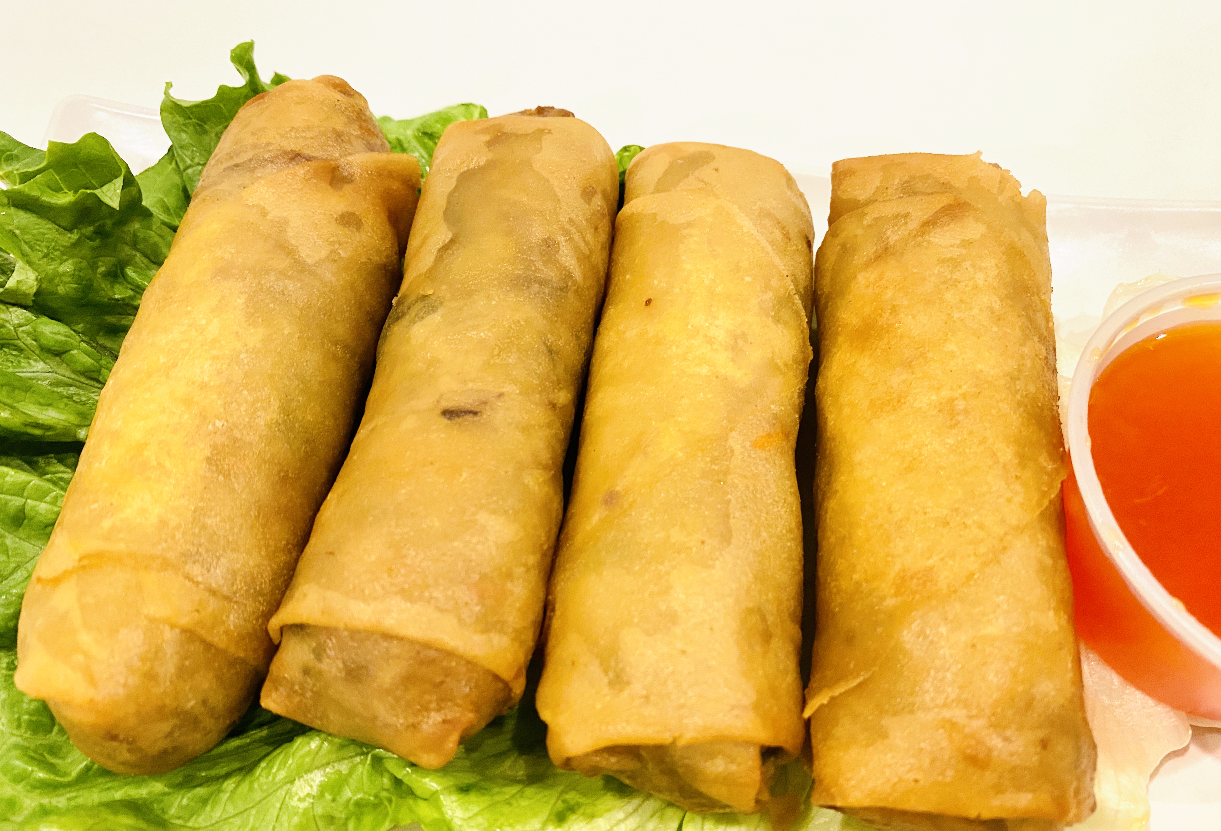 Order Vietnamese Fried Veg Egg Rolls (4 piece) food online from Min Min Asian Cafe store, Chicago on bringmethat.com