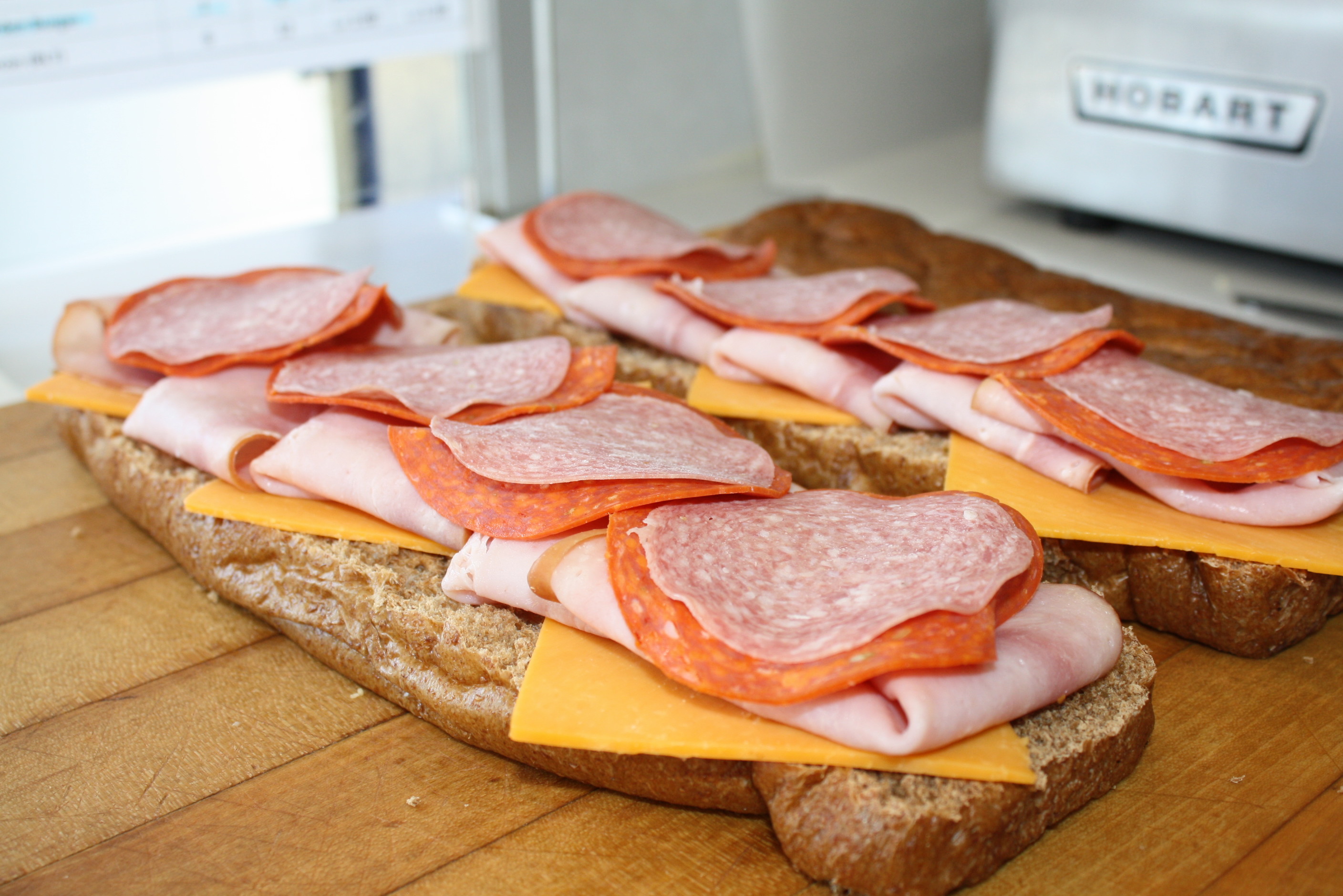 Order 1. Ham, Salami and Pepperoni Sub food online from College Sub Shop store, San Diego on bringmethat.com