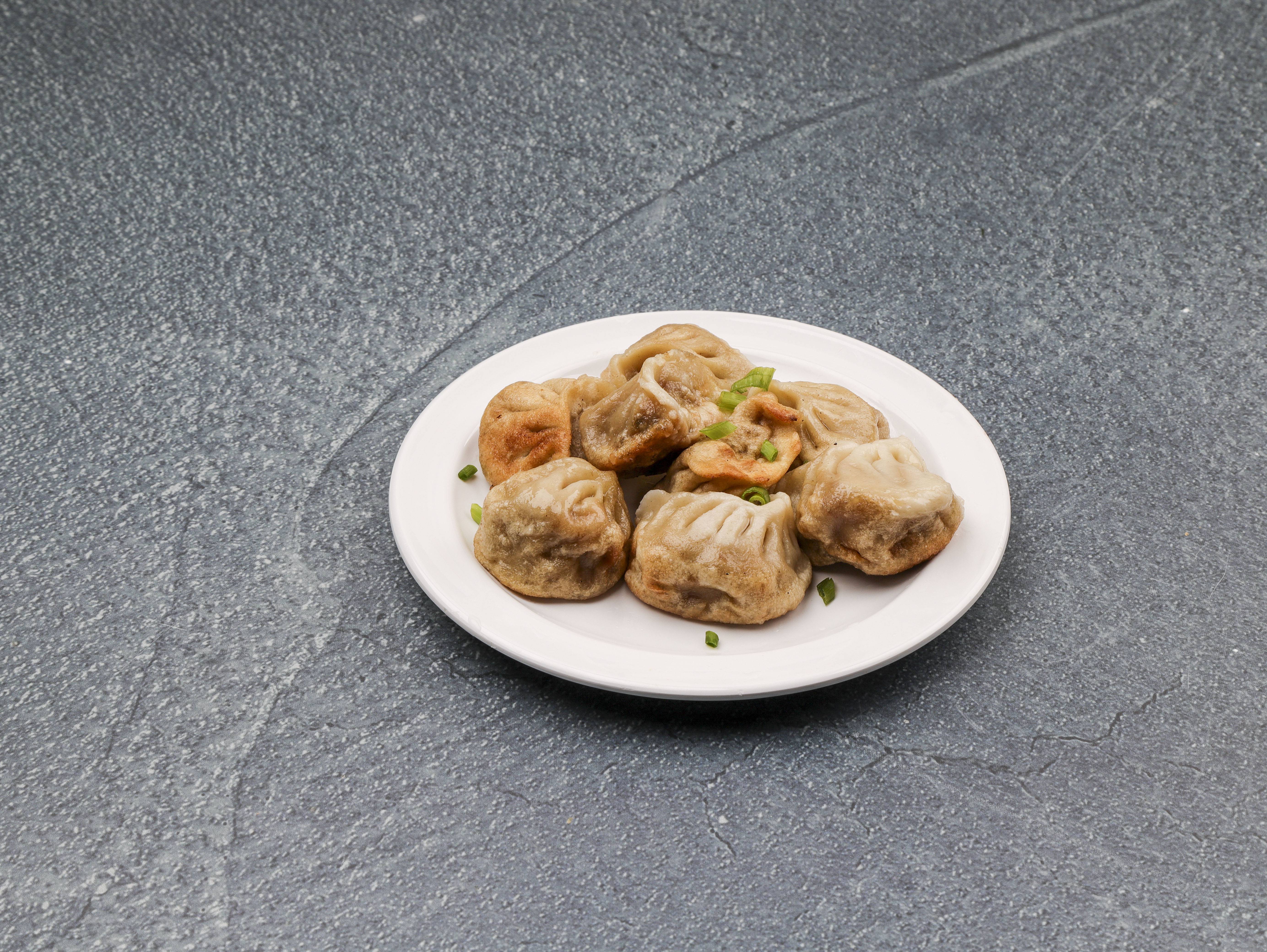 Order 9. Fried Dumpling food online from New China store, St. Louis on bringmethat.com
