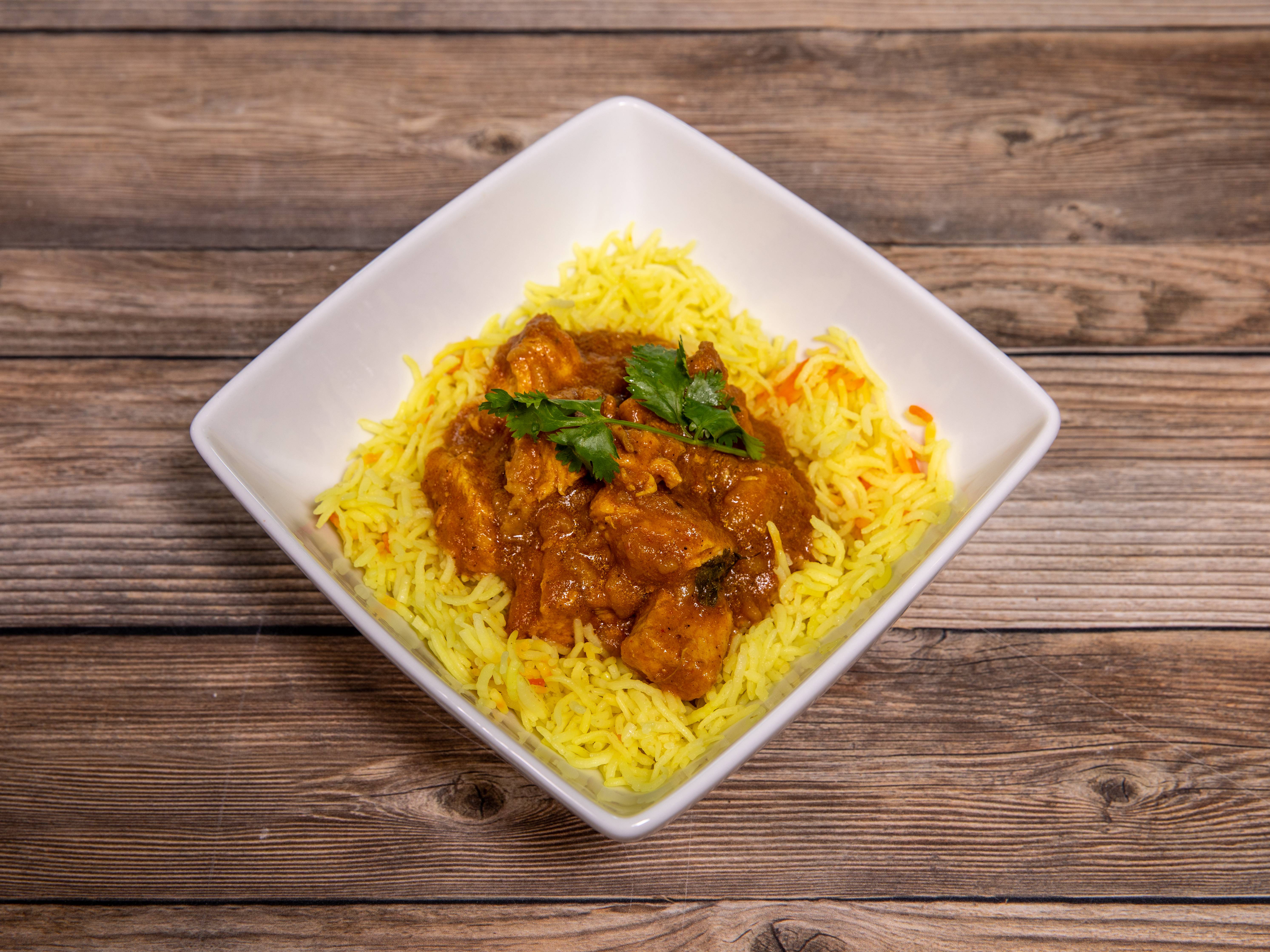 Order Chicken Curry food online from Madras Dhaba store, Austin on bringmethat.com