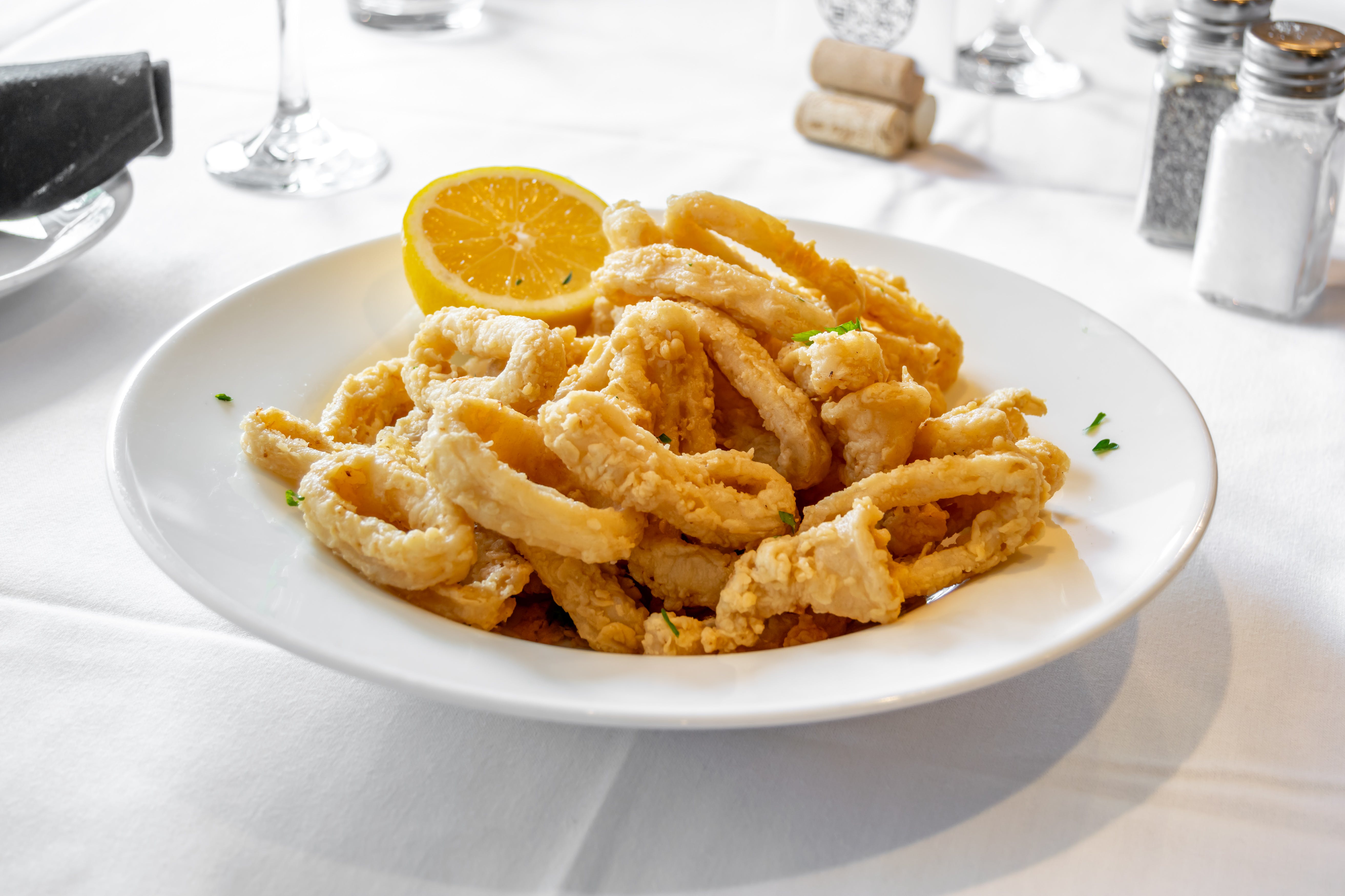 Order Fried Calamari - Appetizer food online from Portofino's Restaurant store, Morristown on bringmethat.com