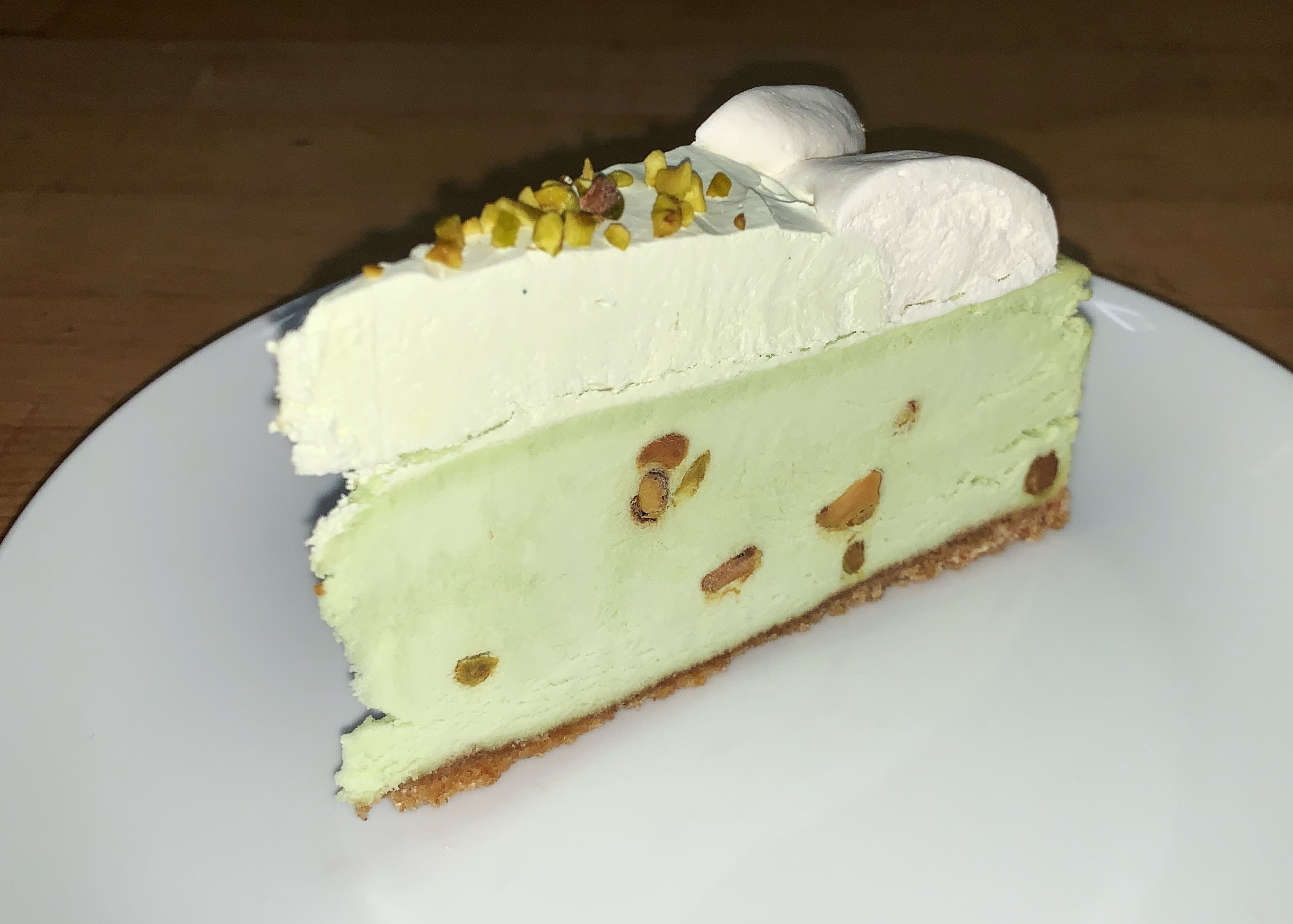 Order Slice of Pistachio Cheesecake food online from Tasty Grill To Go store, Kensington on bringmethat.com