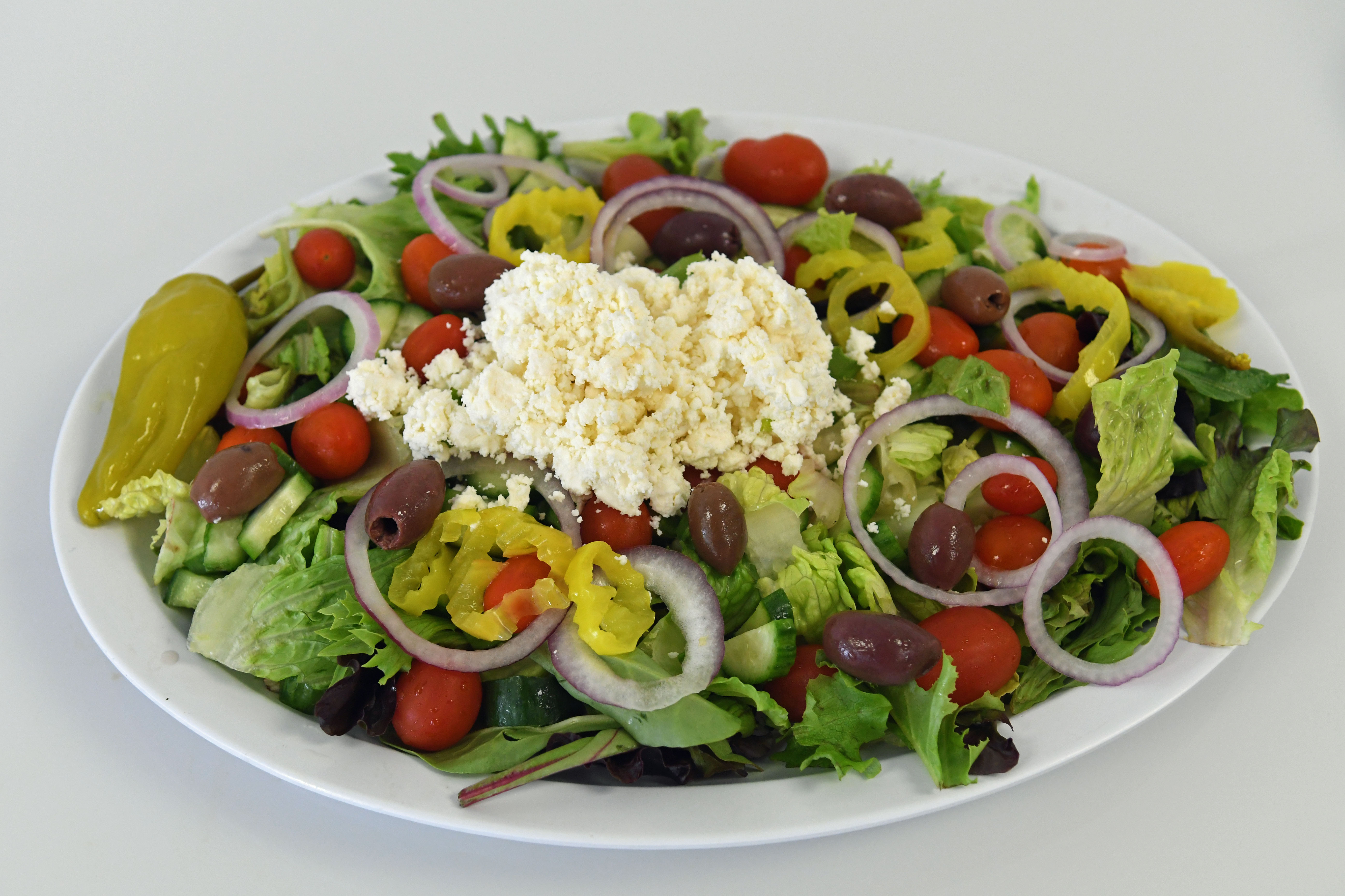 Order Greek Salad food online from Your Greek Cousin store, West Palm Beach on bringmethat.com