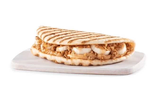 Order PEANUT BUTTER BANANA CRUNCH FLATBREAD food online from Tropical Smoothie Cafe store, Flint Township on bringmethat.com