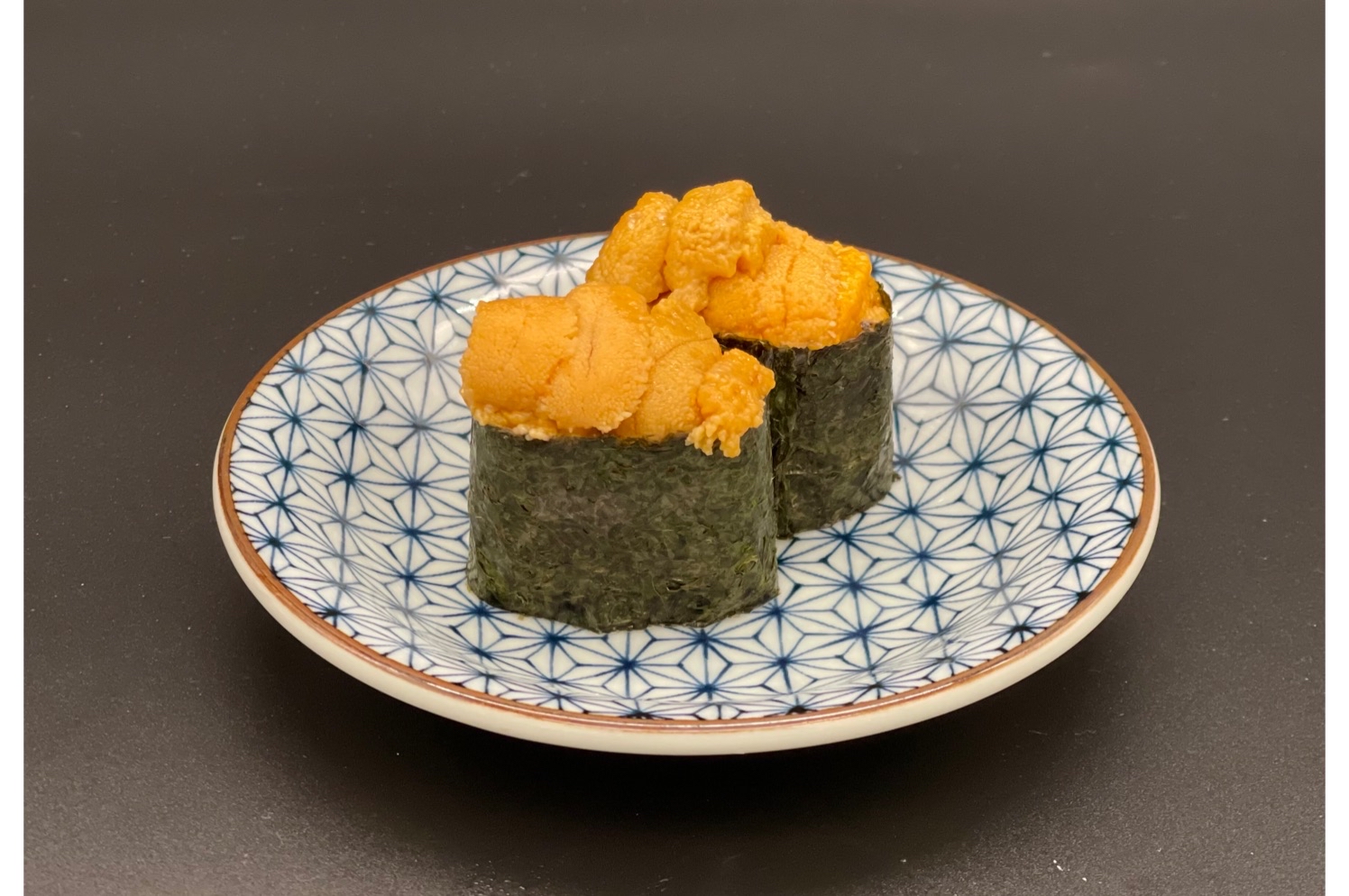 Order 2 Pieces Uni Nigiri food online from Eat Sushi Restaurant store, San Francisco on bringmethat.com