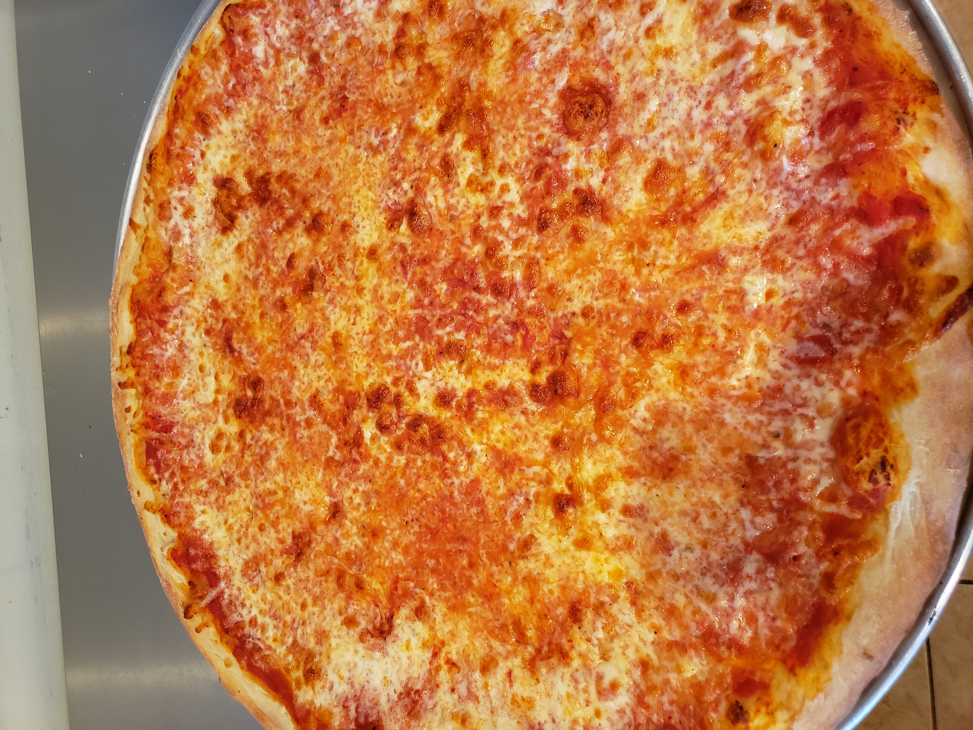 Order Jumbo Pizza by the Slice food online from Big Joe Pizzeria store, East Meadow on bringmethat.com