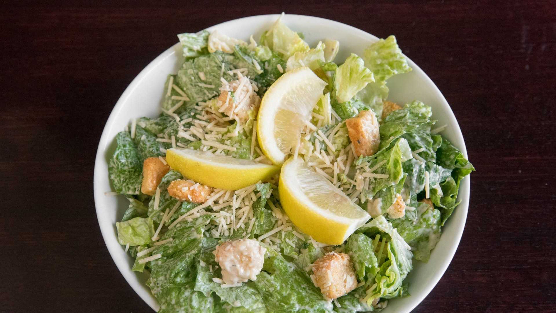 Order Caesar Salad food online from Soprano's Pizza & Pasta store, Seattle on bringmethat.com