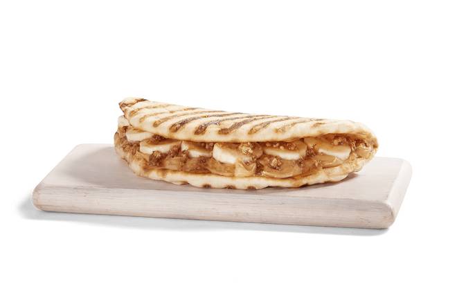 Order PEANUT BUTTER BANANA CRUNCH FLATBREAD food online from Tropical Smoothie Cafe store, Lake City on bringmethat.com
