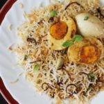 Order 70. Egg Biryani food online from Taj Restaurant store, Warren on bringmethat.com