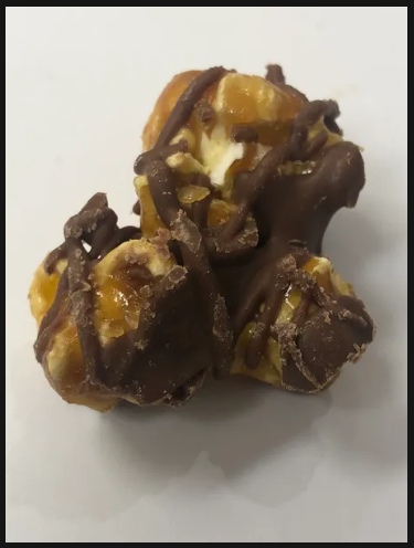 Order Milk Chocolate Drizzle food online from Avery's Savory Popcorn store, Dallas on bringmethat.com