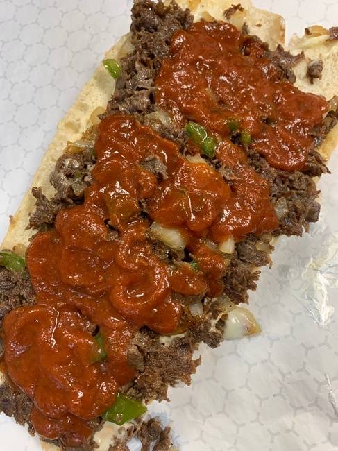 Order (12oz) Philly cheesesteak with peppers onions mozzarella and marinara sauce (12oz of meat on a Amoroso roll) food online from From Philly To Charlit store, Charlotte on bringmethat.com