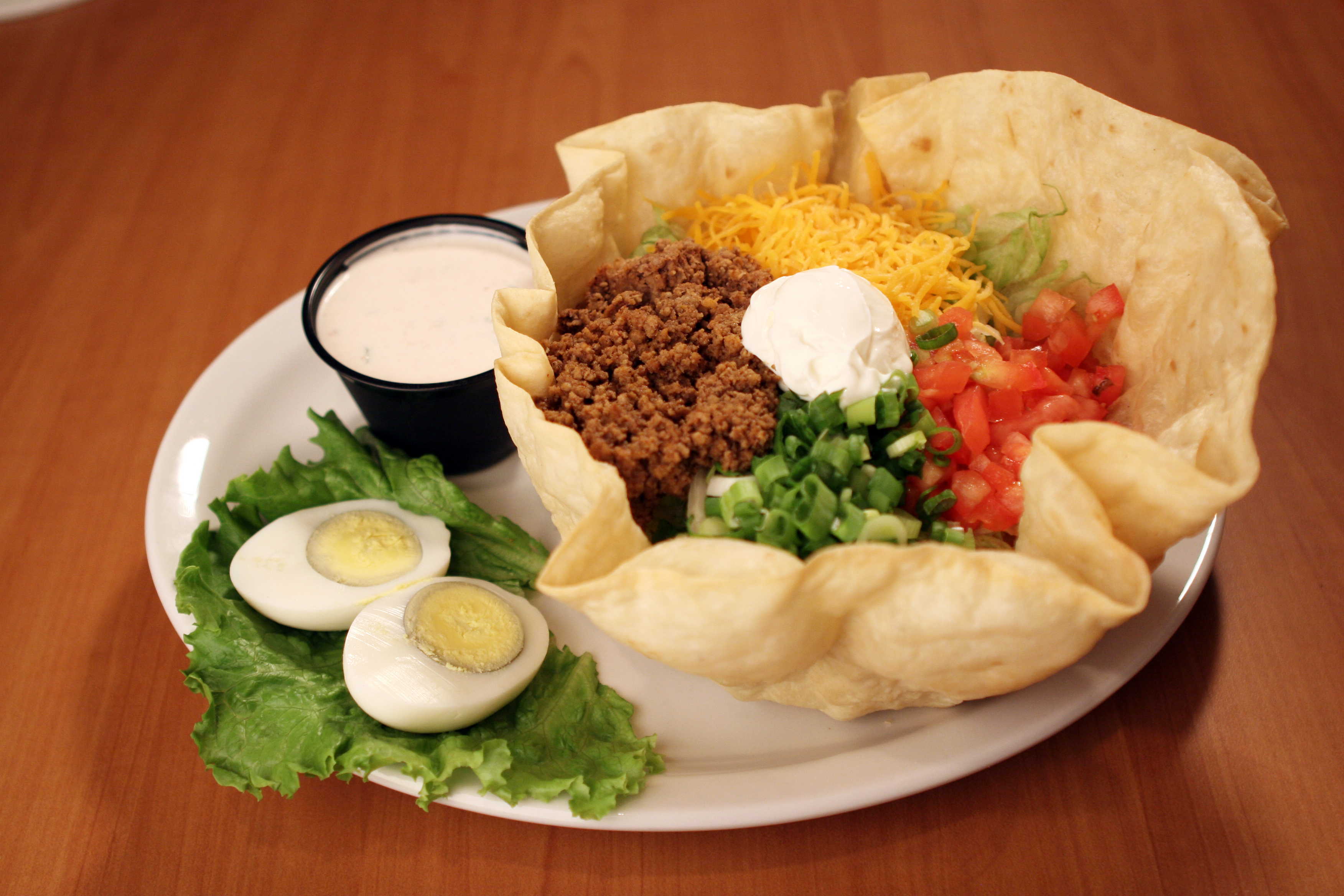 Order Taco Salad food online from Texas Corral store, Kalamazoo on bringmethat.com