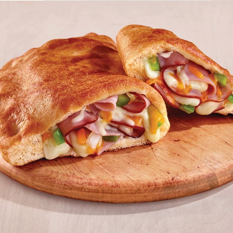 Order Ham & Cheese Stromboli - Medium food online from Pizza Inn store, Mesquite on bringmethat.com