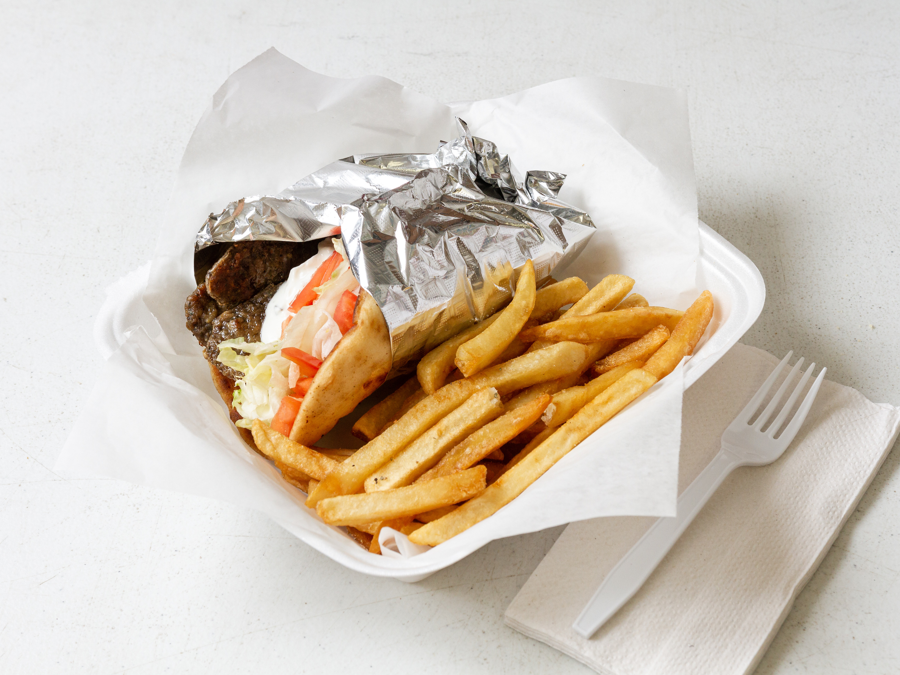 Order Lamb Gyro on a Pita food online from Prima Pizza store, Essex on bringmethat.com