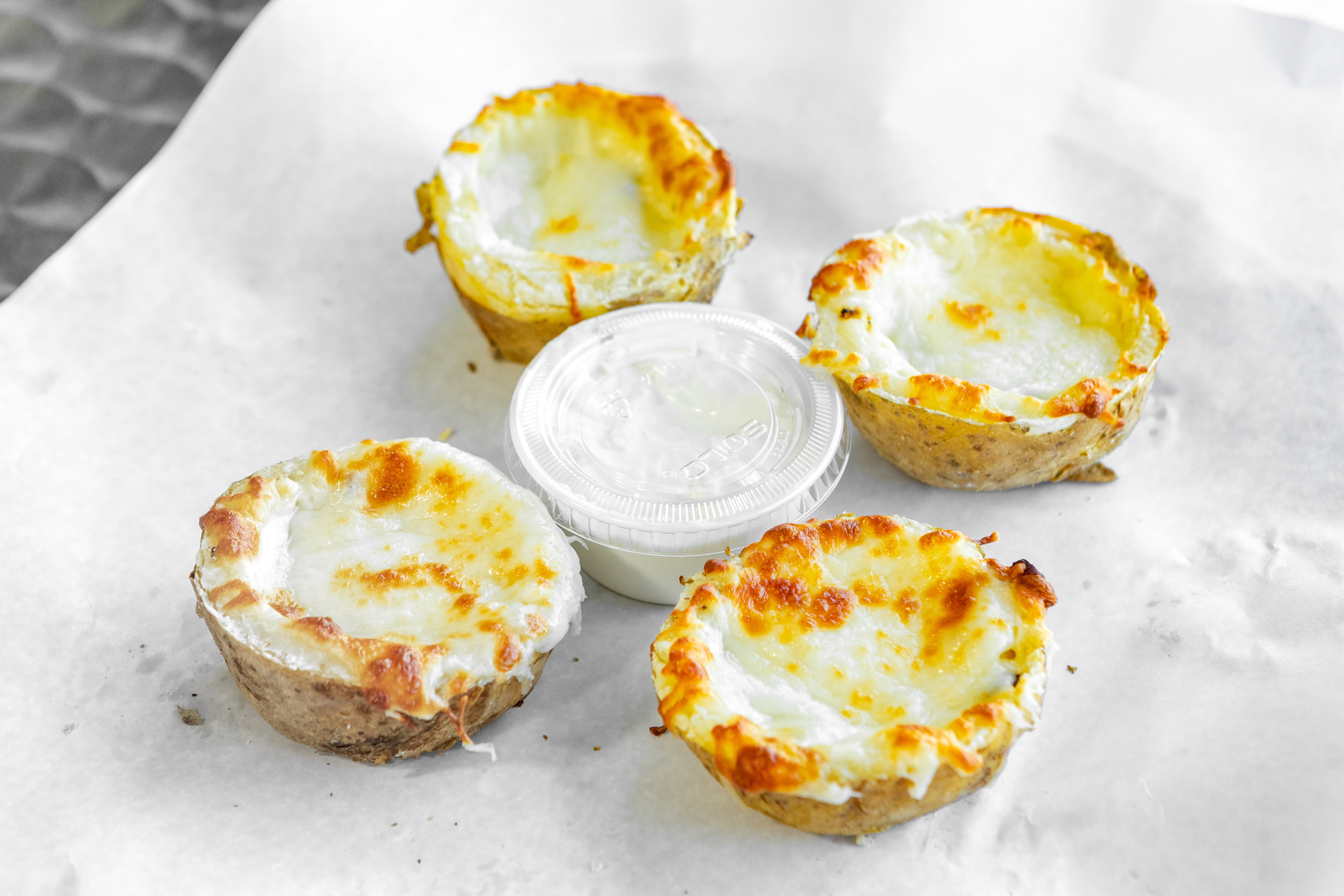 Order Potato Skins with Cheese & Bacon - Side food online from Arboretum store, Roslindale on bringmethat.com