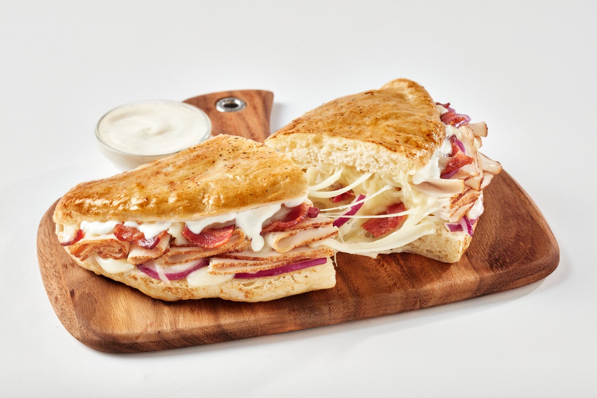 Order Chicken Bacon Ranch Calzone food online from Schlotzsky's store, Sunset Valley on bringmethat.com