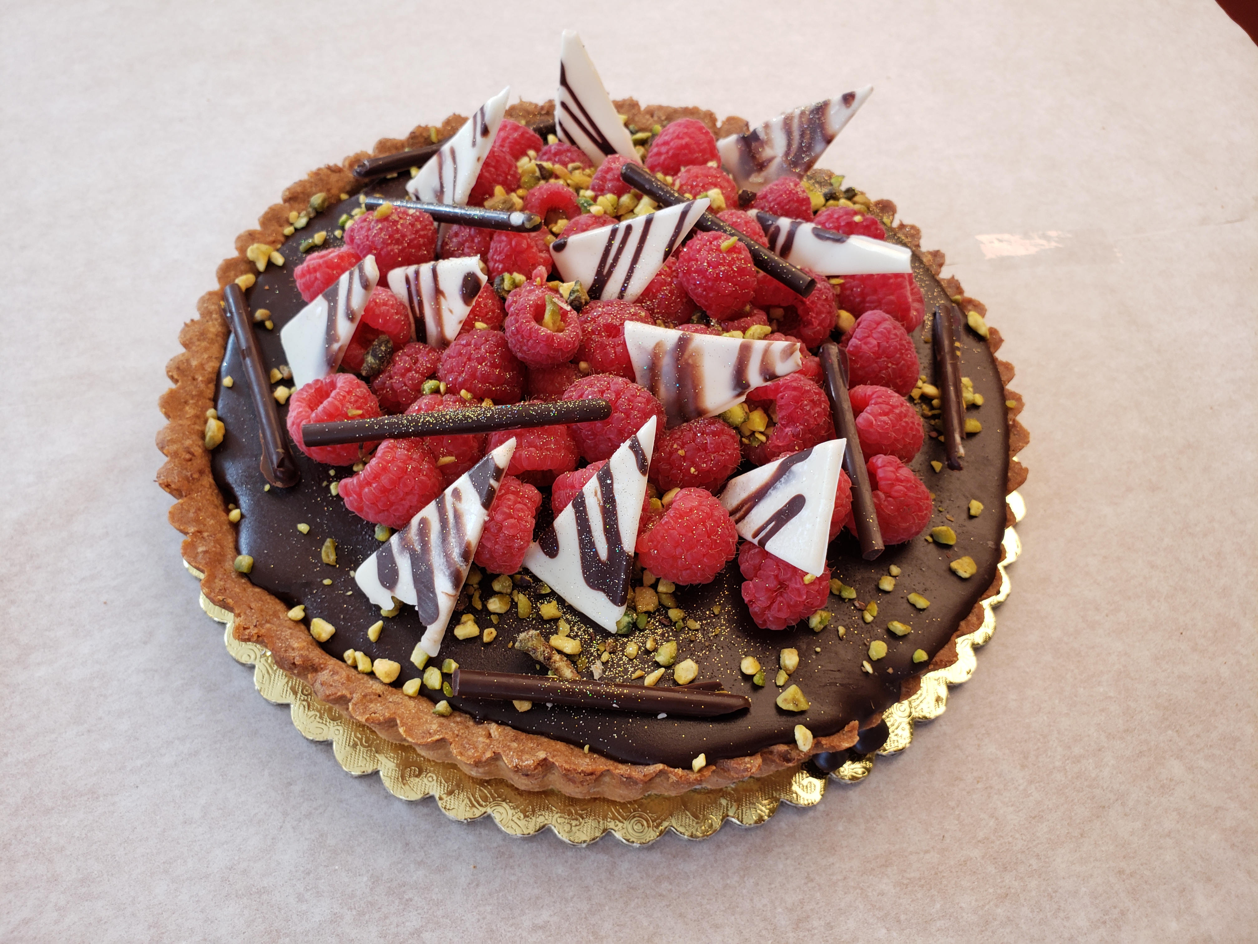 Order 9" Chocolate Raspberry Tart food online from Vienna Pastry store, Los Angeles on bringmethat.com