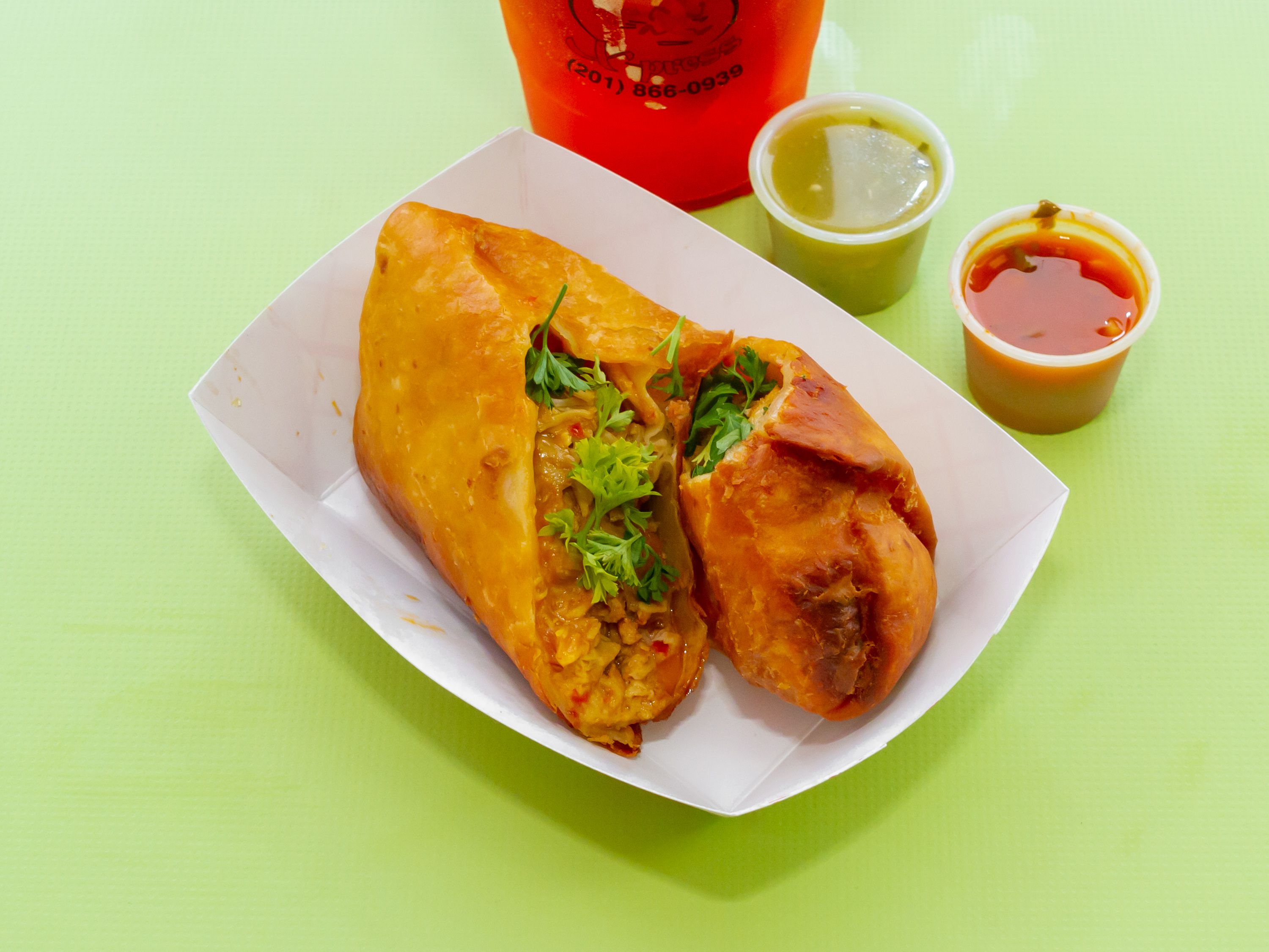 Order Pollo Chimichanga Picante ( choose between fried or grilled) food online from Empanadas X-Press store, Union City on bringmethat.com