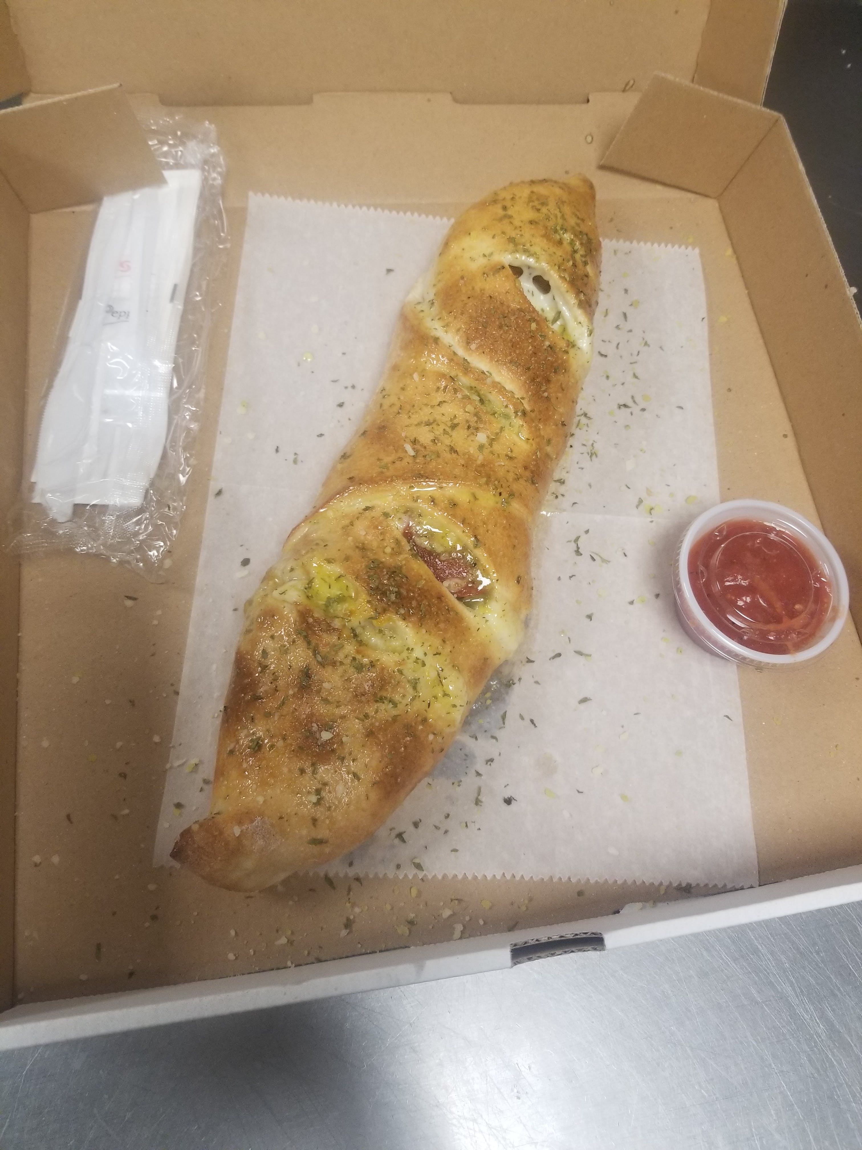 Order Italian Deluxe Stromboli - One Size food online from Queens Pizza & Subs store, Greensboro on bringmethat.com