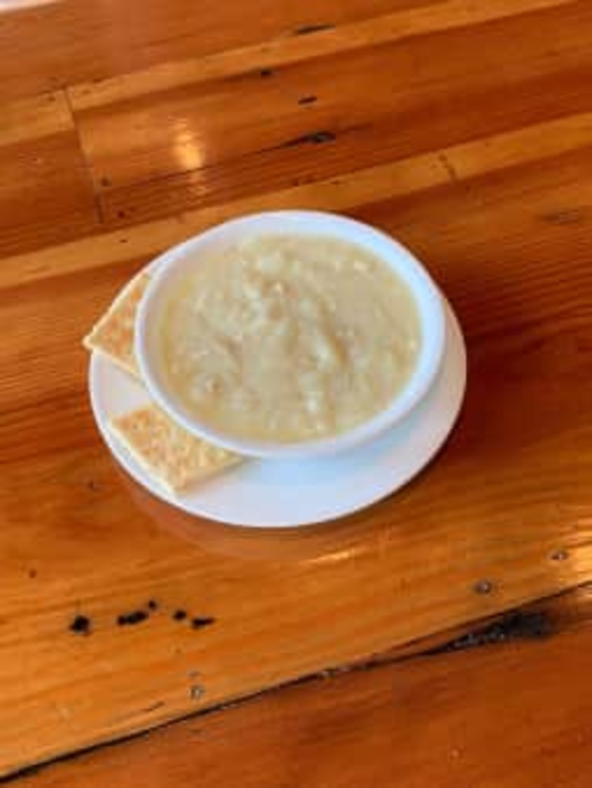 Order HOMEMADE CHICKEN-LEMON RICE SOUP CUP (AVGOLEMONO) food online from Little Greek Fresh Grill store, Youngstown on bringmethat.com