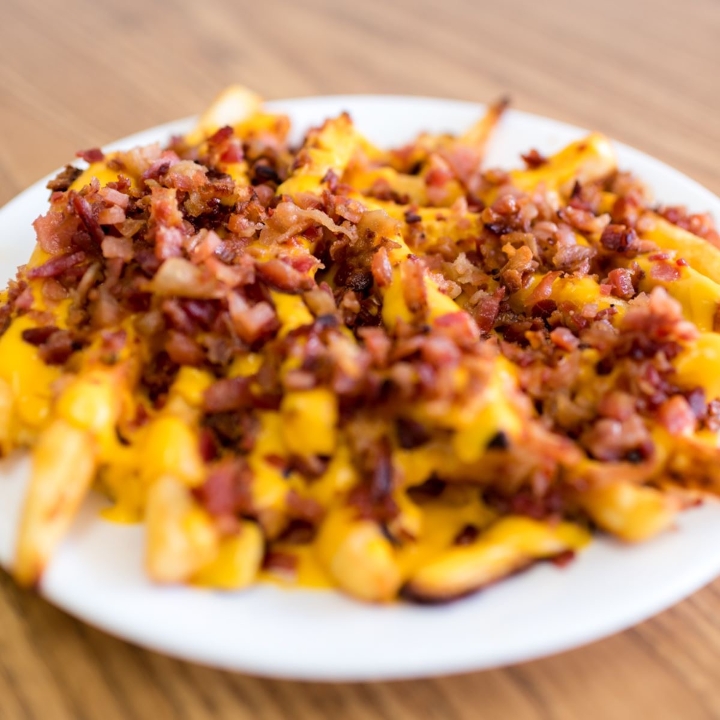 Order Bacon CHEESE FRIES* food online from Pasquale's Pizzeria store, Dravosburg on bringmethat.com