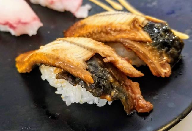 Order Unagi (eel fish) Sushi Nigiri 2pcs food online from Koko Teriyaki store, Dupont on bringmethat.com