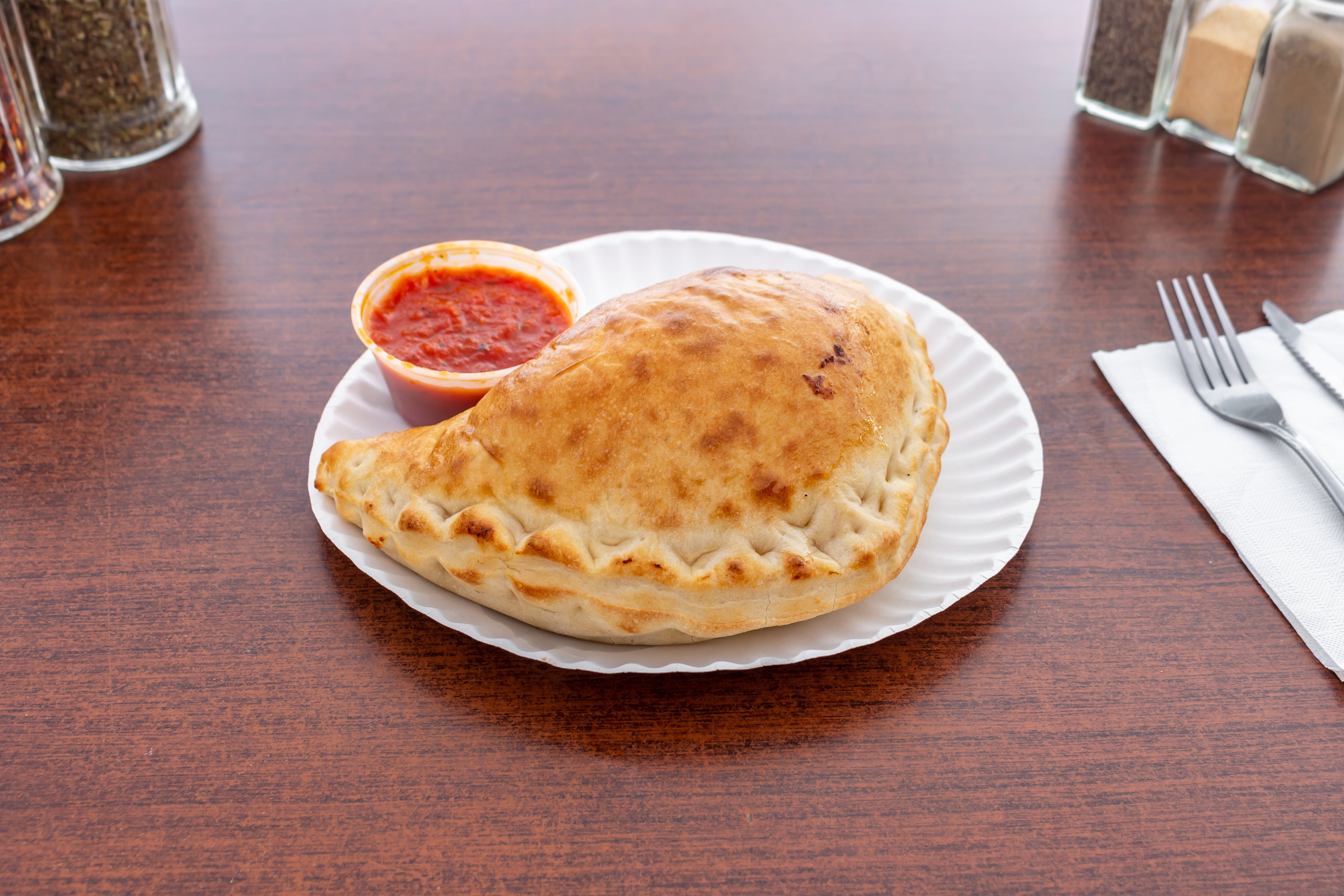 Order Calzone - Calzone food online from Sopranos Pizzeria store, New Milford on bringmethat.com