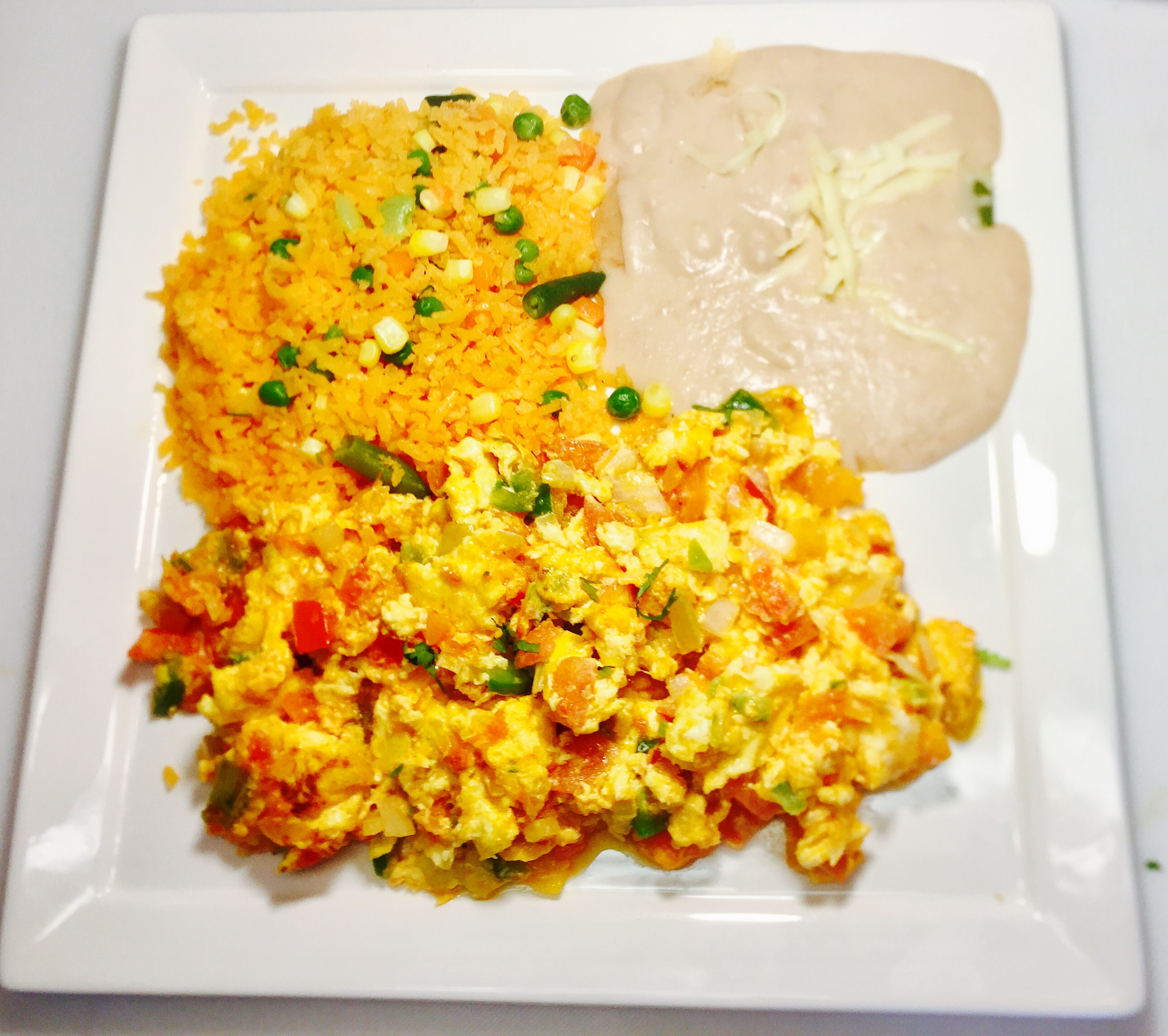 Order Huevos  a la Mexicana food online from Ixcateco Grill store, Chicago on bringmethat.com