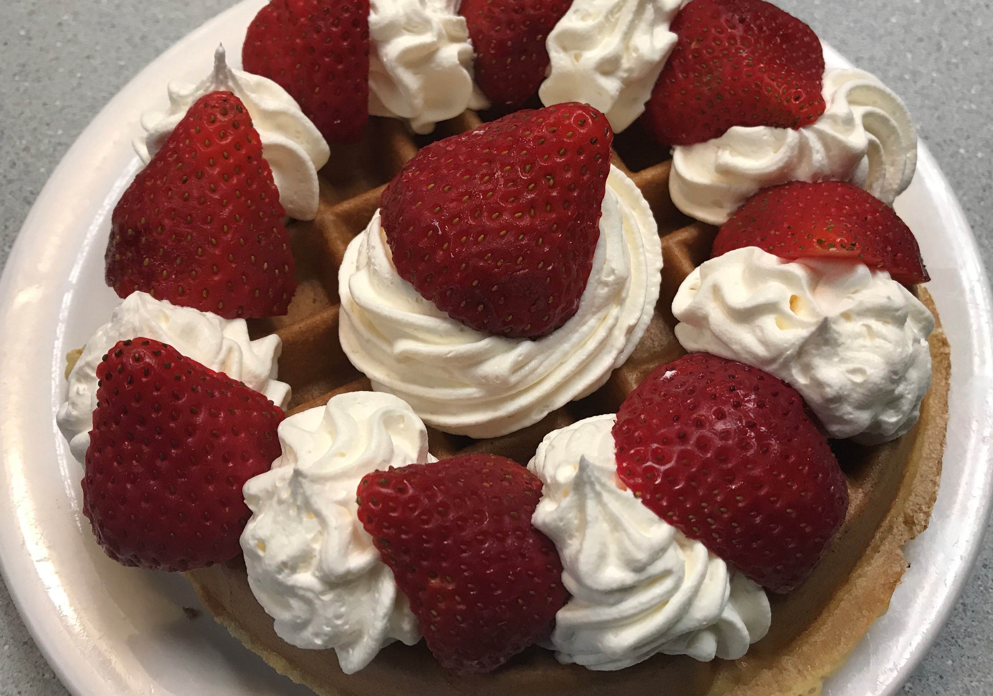 Order Belgian Waffle W/ Strawberries & Whipped Cream food online from Manhattan Deli store, Mentor on bringmethat.com