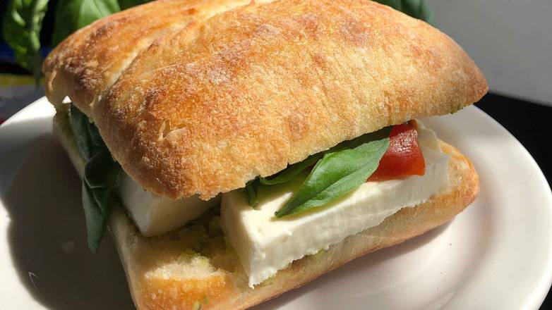 Order Pesto Caprese Sandwich  food online from East Village Cafe store, Monterey on bringmethat.com