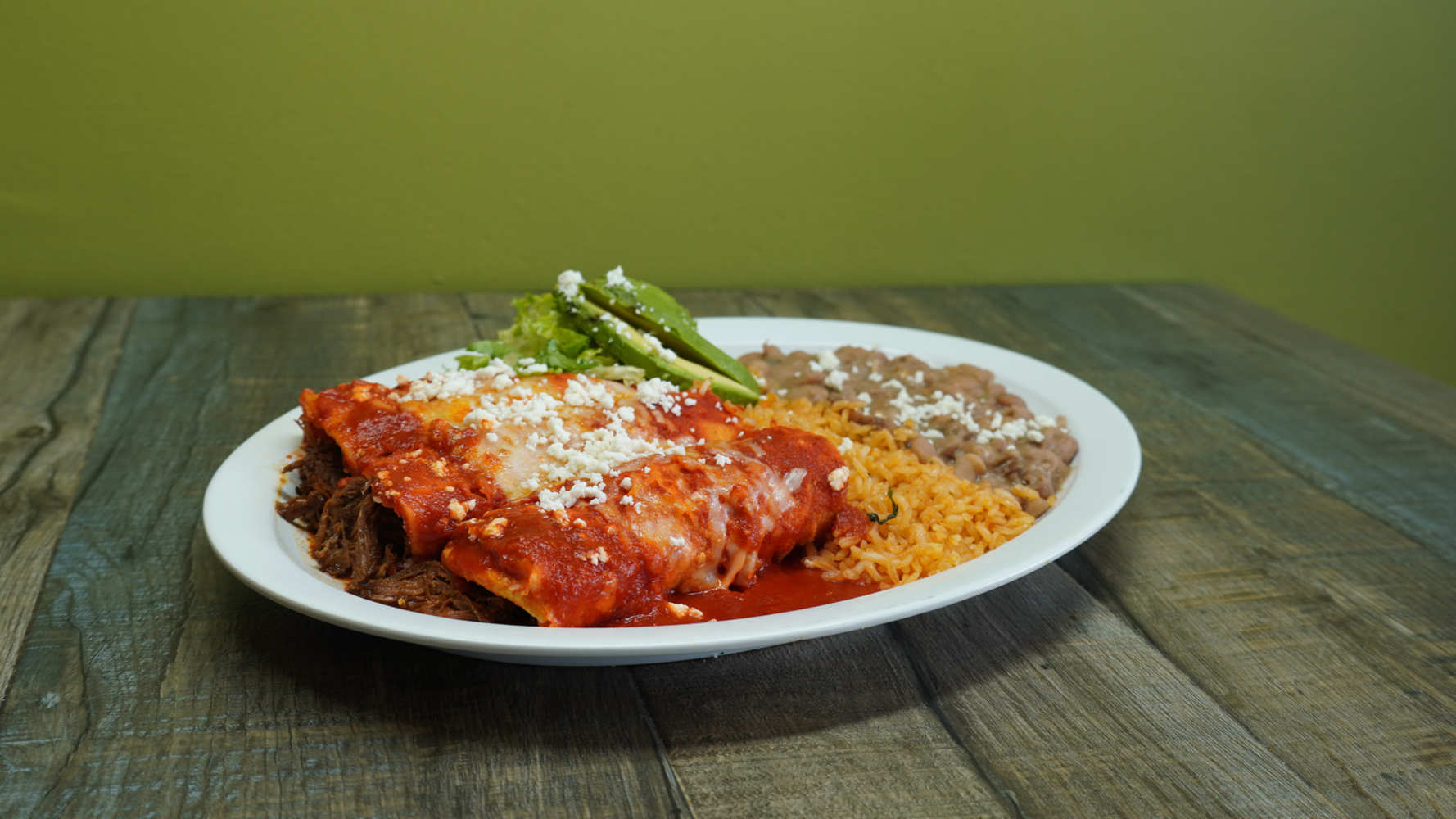 Order New! Beef Barbacoa Enchiladas food online from Benny Munchies store, Culver City on bringmethat.com