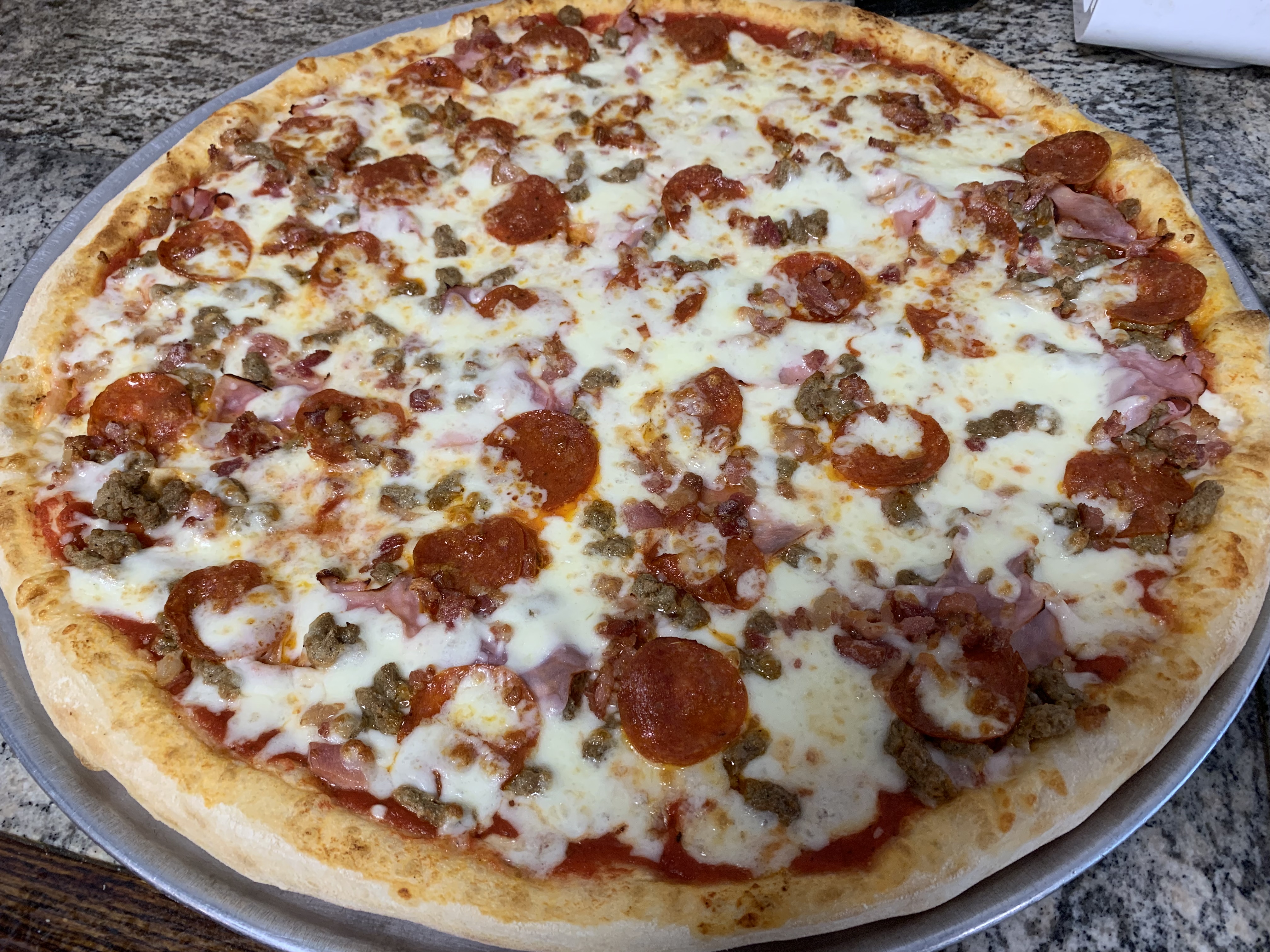 Order Meat Lovers Pizza food online from Mario's Pizza store, Newark on bringmethat.com