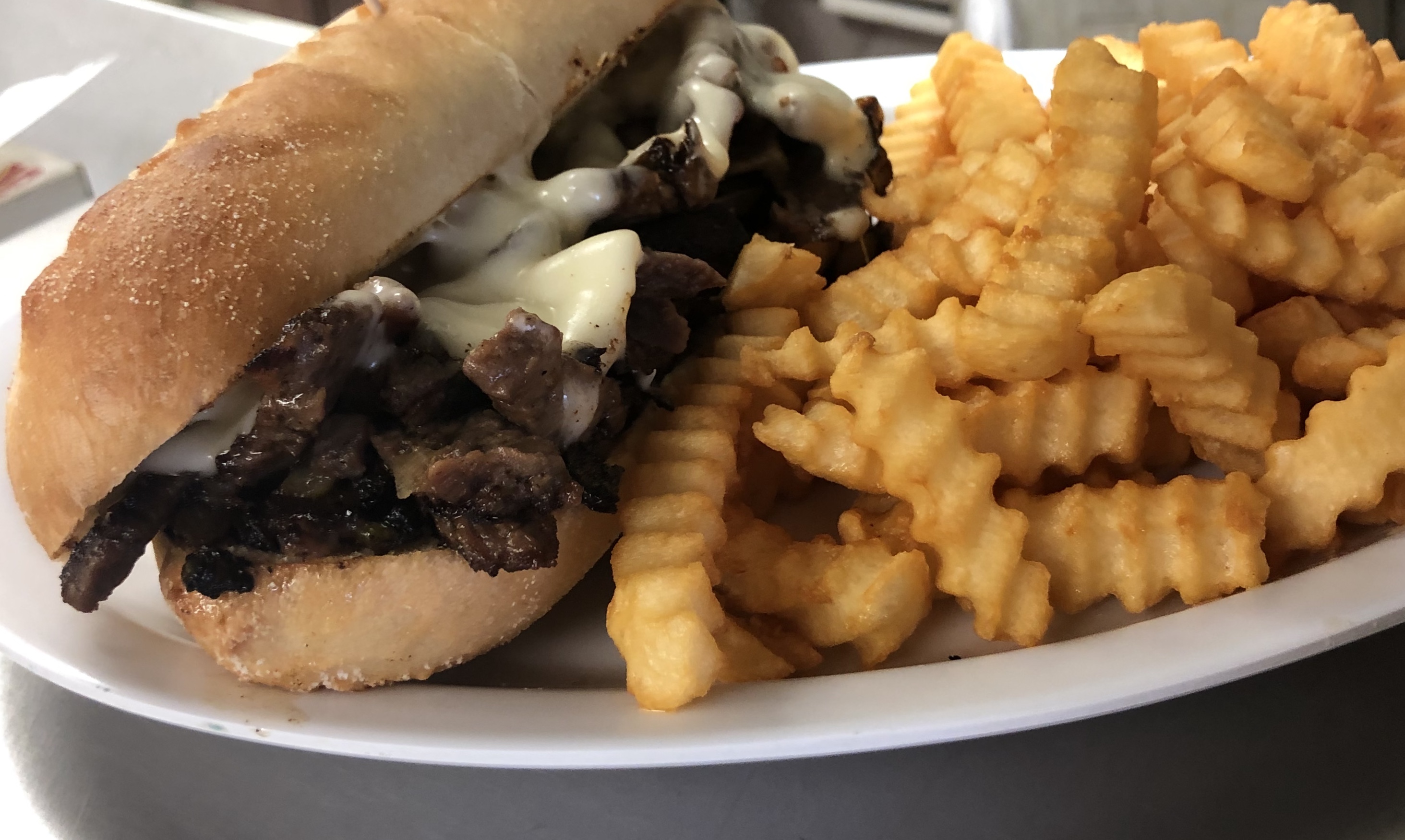 Order #34. Philly Steak & Cheese Grinder food online from Klemm Candlelight Cafe store, Fort Wayne on bringmethat.com