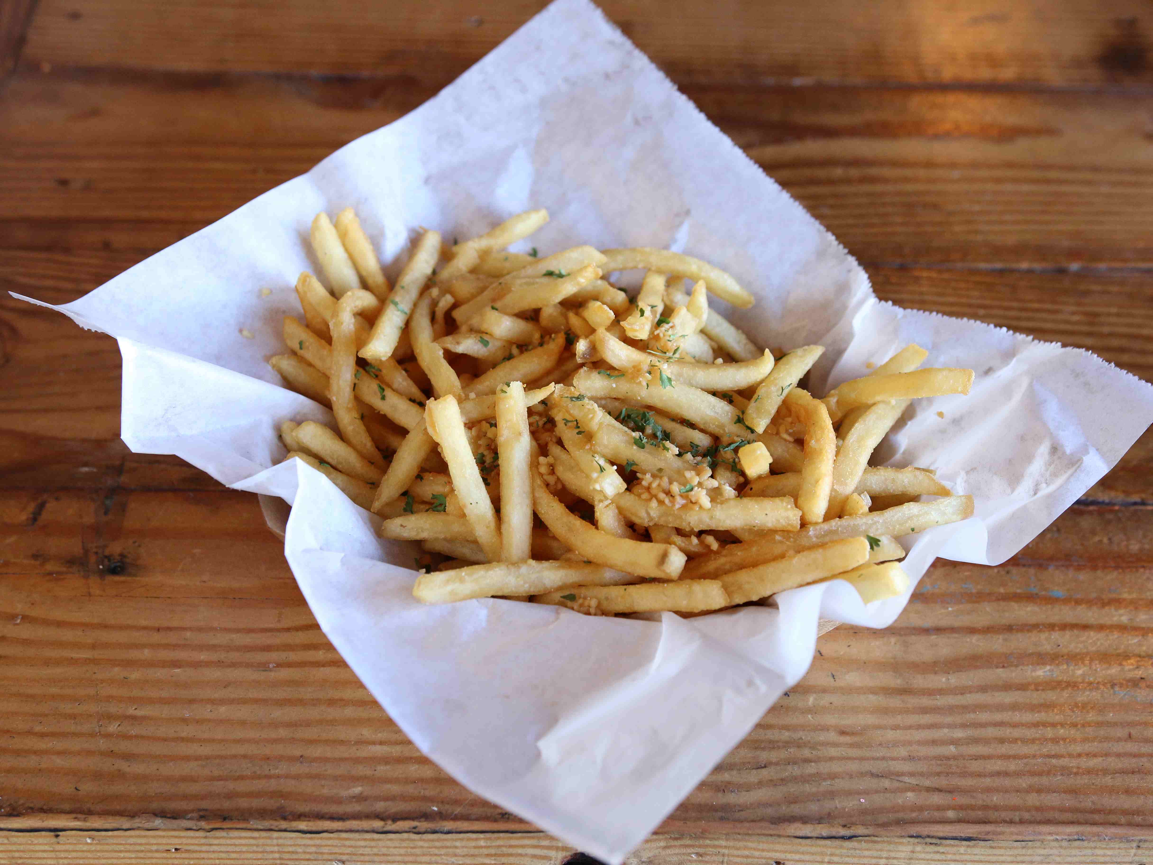 Order Garlic Fries food online from Wings & Bowls store, Claremont on bringmethat.com